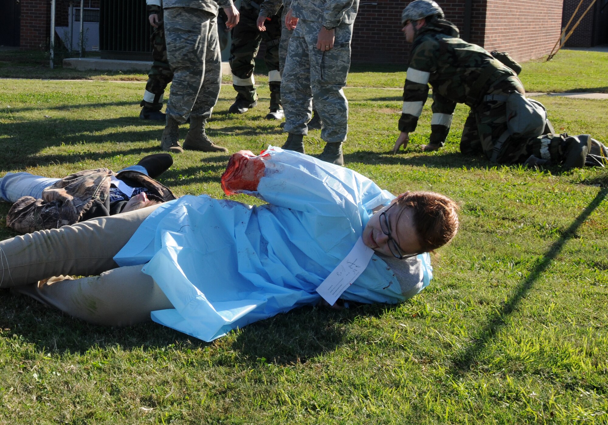 Members of the 188th Student Flight role play as victims of a simulated rocket attack during a mass casualty exercise at Ebbing Air National Guard Base, Fort Smith, Ark., Nov. 2, 2014. The purpose of the exercise was to test Airmen’s ability to triage personnel while facing possible attacks. (U.S. Air National Guard photo by Airman 1st Class Cody Martin/Released)