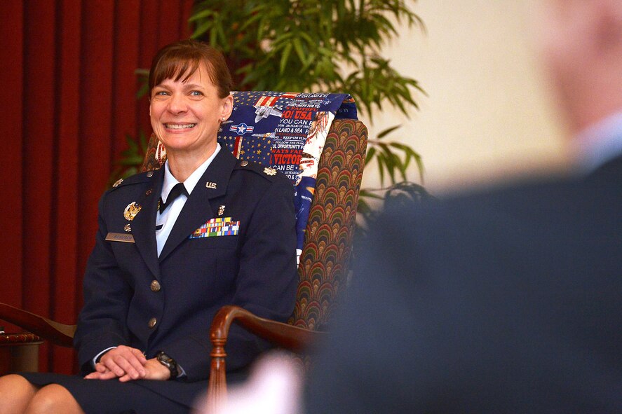 Lt. Col. Therese Bohusch, 66th Medical squadron commander, smiles at her husband Jeff Franklin during a ceremony at the Minuteman Commons Nov. 25. Bohusch was promoted to the rank of colonel during the ceremony. (U.S. Air Force photo by Jerry Saslav)