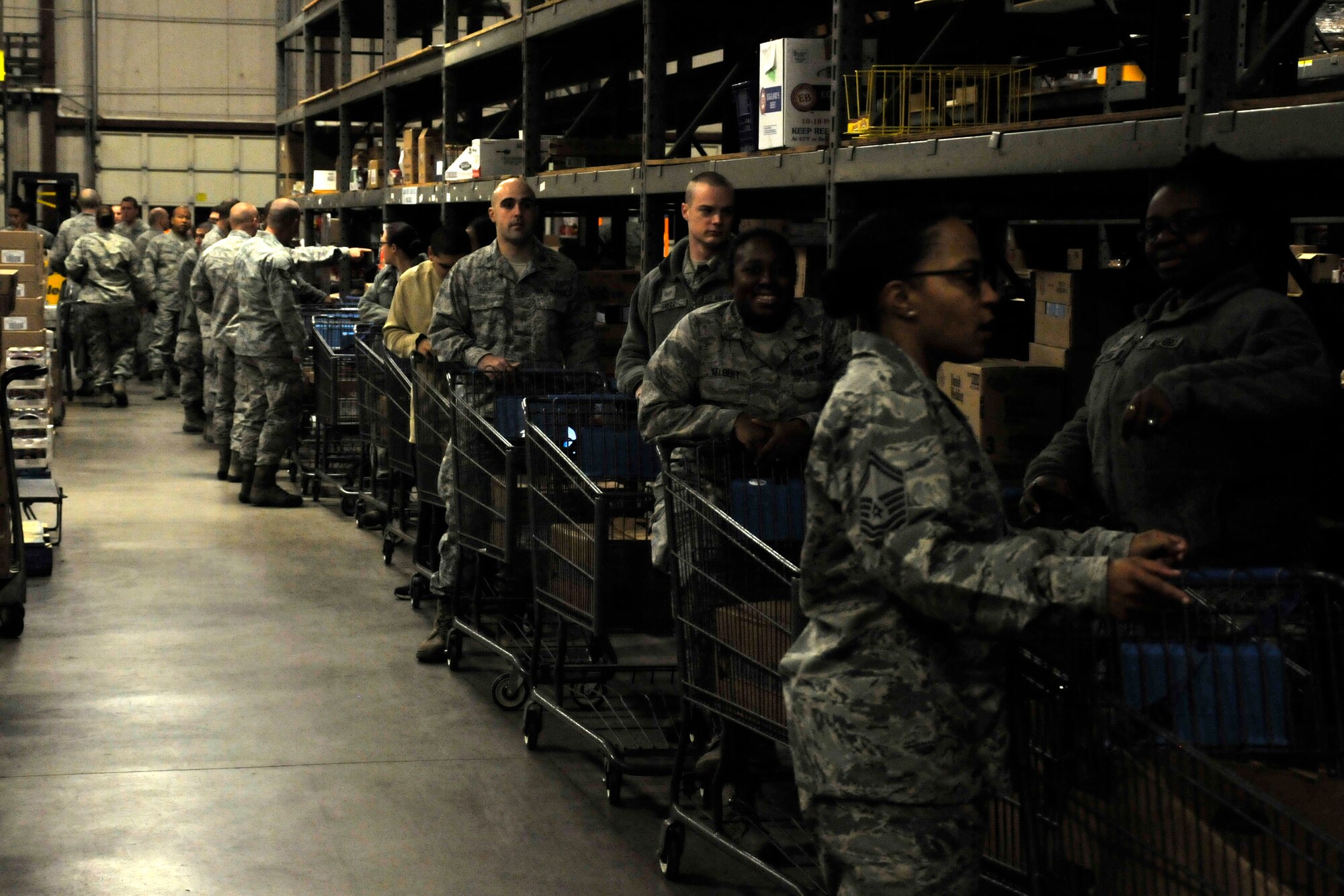 GOODFELLOW AIR FORCE BASE, Texas – Team Goodfellow Airmen stand in line at the start of Operation Warmheart inside the commissary Nov. 25. Volunteers filled boxes with food and gave them to families for Thanksgiving. (U.S. Air Force photo/ Airman 1st Class Scott Jackson)