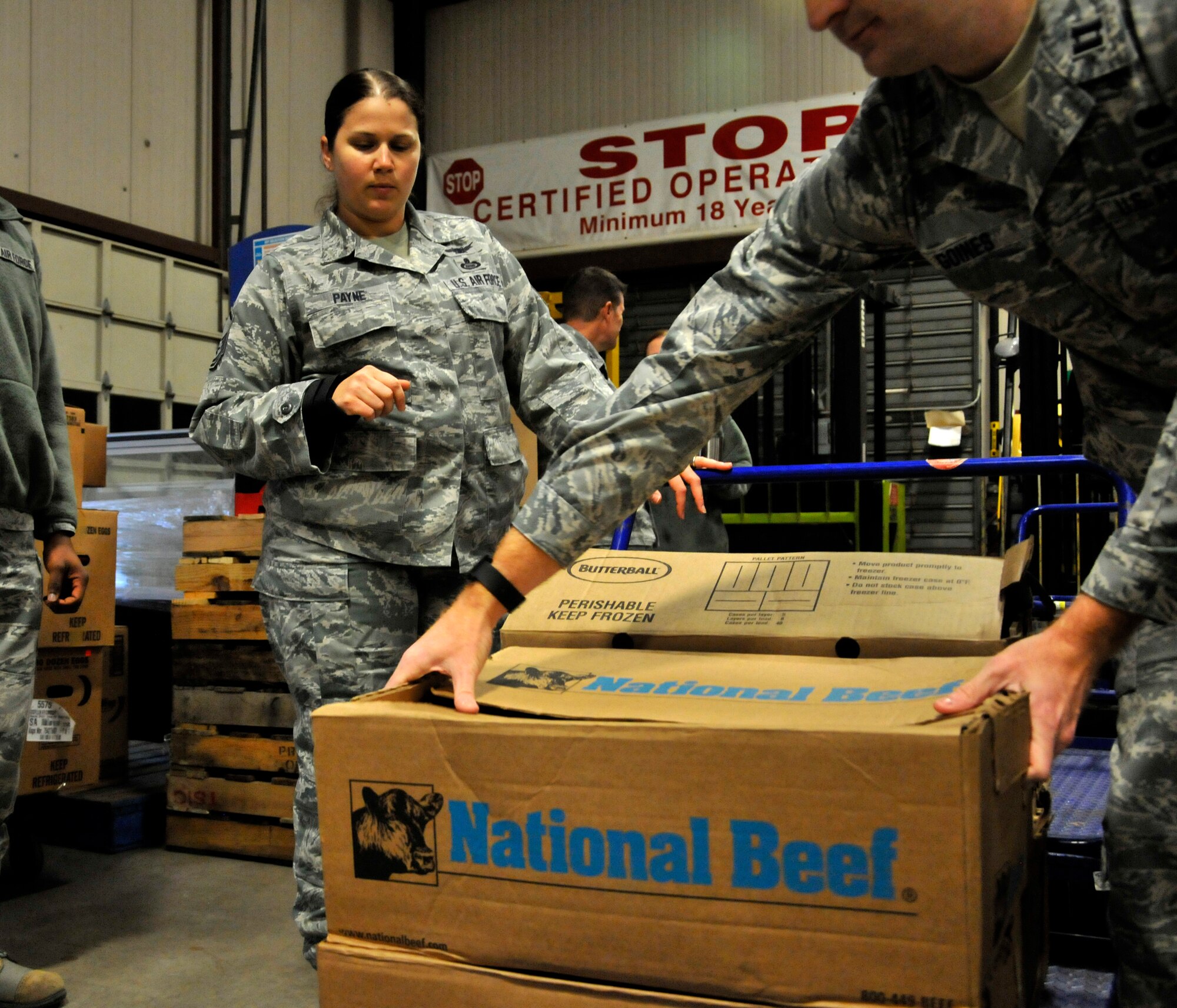 GOODFELLOW AIR FORCE BASE, Texas – Master Sgt. Lisa A. Payne, 315th Training Squadron assistant first sergeant, instructs box placement during Operation Warmheart Nov. 25. This year, volunteers helped produce 172 boxes for members of Team Goodfellow. (U.S. Air Force photo/ Airman 1st Class Scott Jackson)