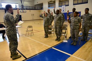 U.S. Air Force Airmen acting as jury members are sworn in during a “Got Consent” mock trial at Langley Air Force Base, Va., Nov. 21, 2014. During the trial, Airmen acted as the victim, the accused and the jury in order to get a better understanding of how a courts martial for sexual assault works. (U.S. Air Force photo by Senior Airman Aubrey White/Released) 