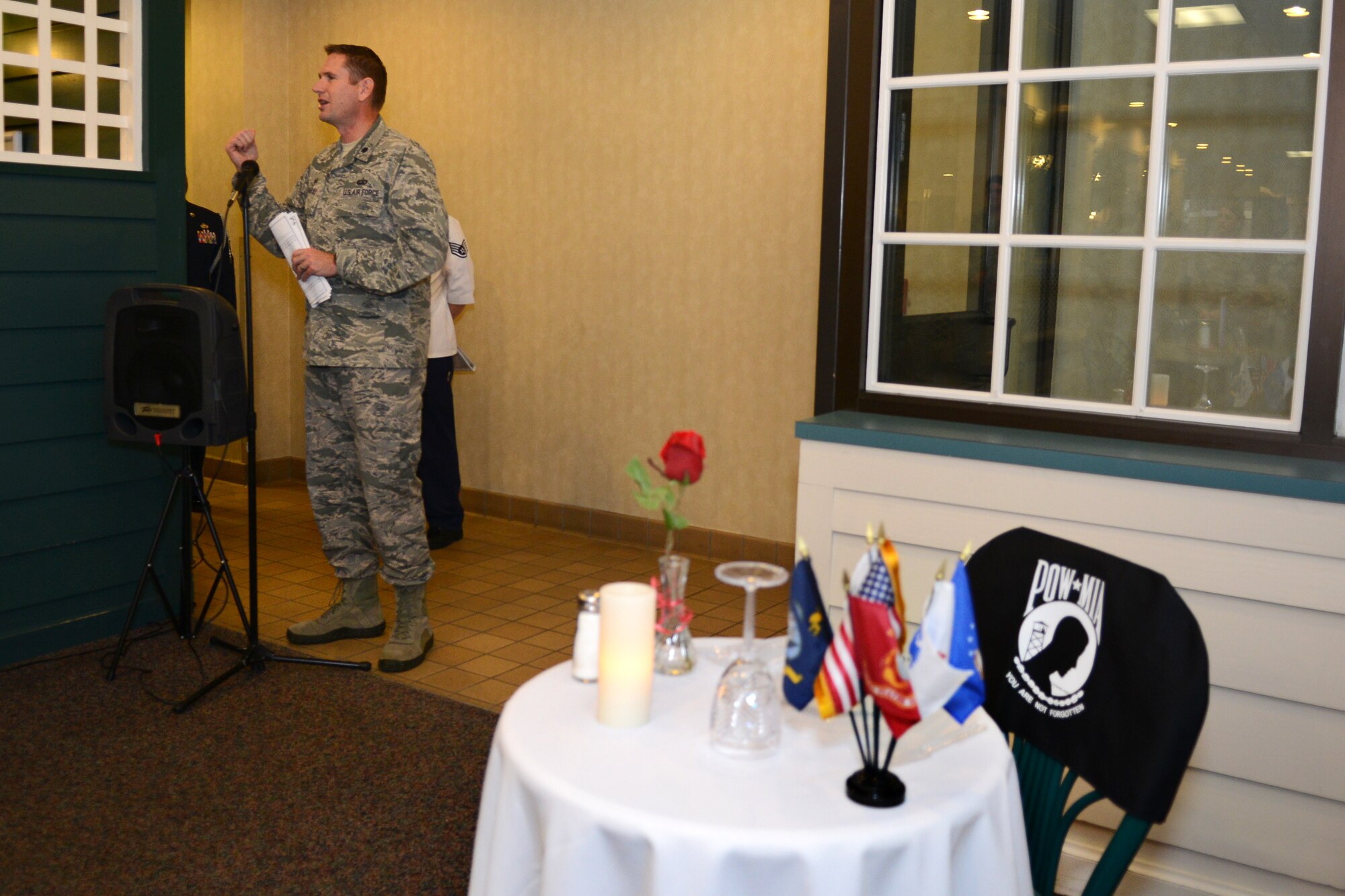 U.S. Air Force Lt. Col. Gregory Beaulieu, 633rd Force Support Squadron commander, provides closing remarks during the POW/MIA dedication ceremony in the Crossbow Dining Facility at Langley Air Force Base, Va., Nov. 25, 2014. Beaulieu said the statements, “Leave No One Behind” and “You Are Not Forgotten,” are more than words on a flag. He said the sentiment behind those words drives the Air Force mission. (U.S. Air Force photo by Airman 1st Class Devin Scott Michaels/Released)