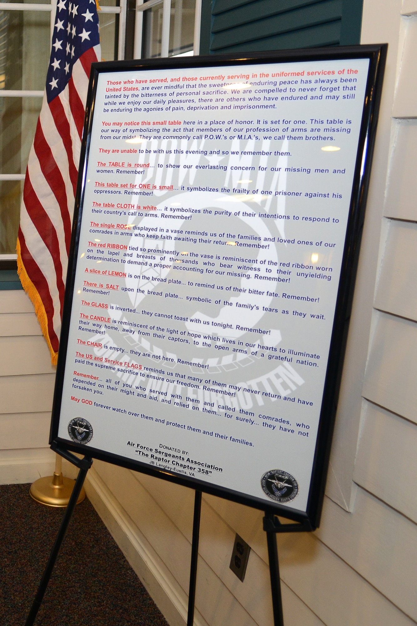 The Air Force Sergeants Association, “The Raptor Chapter 358” donated a Prisoner of War, Missing in Action dedication plaque to the Crossbow Dining Facility at Langley Air Force Base, Va., Nov. 25, 2014. The donation is symbolic of the U.S. Air Force’s “bittersweet” gratitude to those who have been captured as POWs or gone missing in action. (U.S. Air Force photo by Airman 1st Class Devin Scott Michaels/Released)(This photo was cropped to emphasize the subject and levels were adjusted for aesthetic purposes)