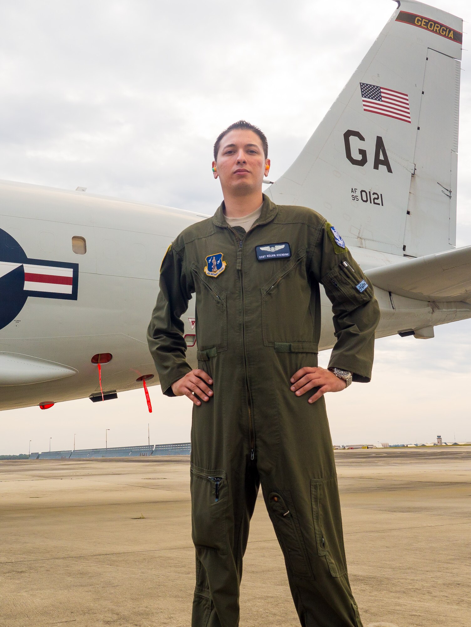 U.S. Air Force Staff Sgt. Kelvin Oxendine, an airborne operations technician with the 116th Air Control Wing, Georgia Air National Guard, stands beside an E-8C Joint STARS, Robins Air Force Base, Ga., Nov. 5, 2014. Oxendine is a member of the Lumbee Indian tribe out of Robeson County, North Carolina. The tribe has more than 55,000 members with two of the members serving together in the Georgia Air National Guard at Robins Air Force Base. Oxendine and a fellow Airman are descendants of Henry Berry Lowry, a young Native American Revolutionist who rose up in 1865 to fight injustice being directed against his people who are the modern day Lumbee Indians. Lowry came to be known as the Indian Robin Hood for his exploits. (U.S. Air National Guard photo by Master Sgt. Roger Parsons/Released)