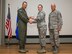 From left: Col. David Radomski, 412th Test Wing vice commander, presents the Airman of the Quarter award to Senior Airman Kassandra VanBeek, 412th Communications Squadron, as Chief Master Sgt. James Pittman, 412th Operations Group, looks on. (U.S. Air Force photo by Scott Dworkin)