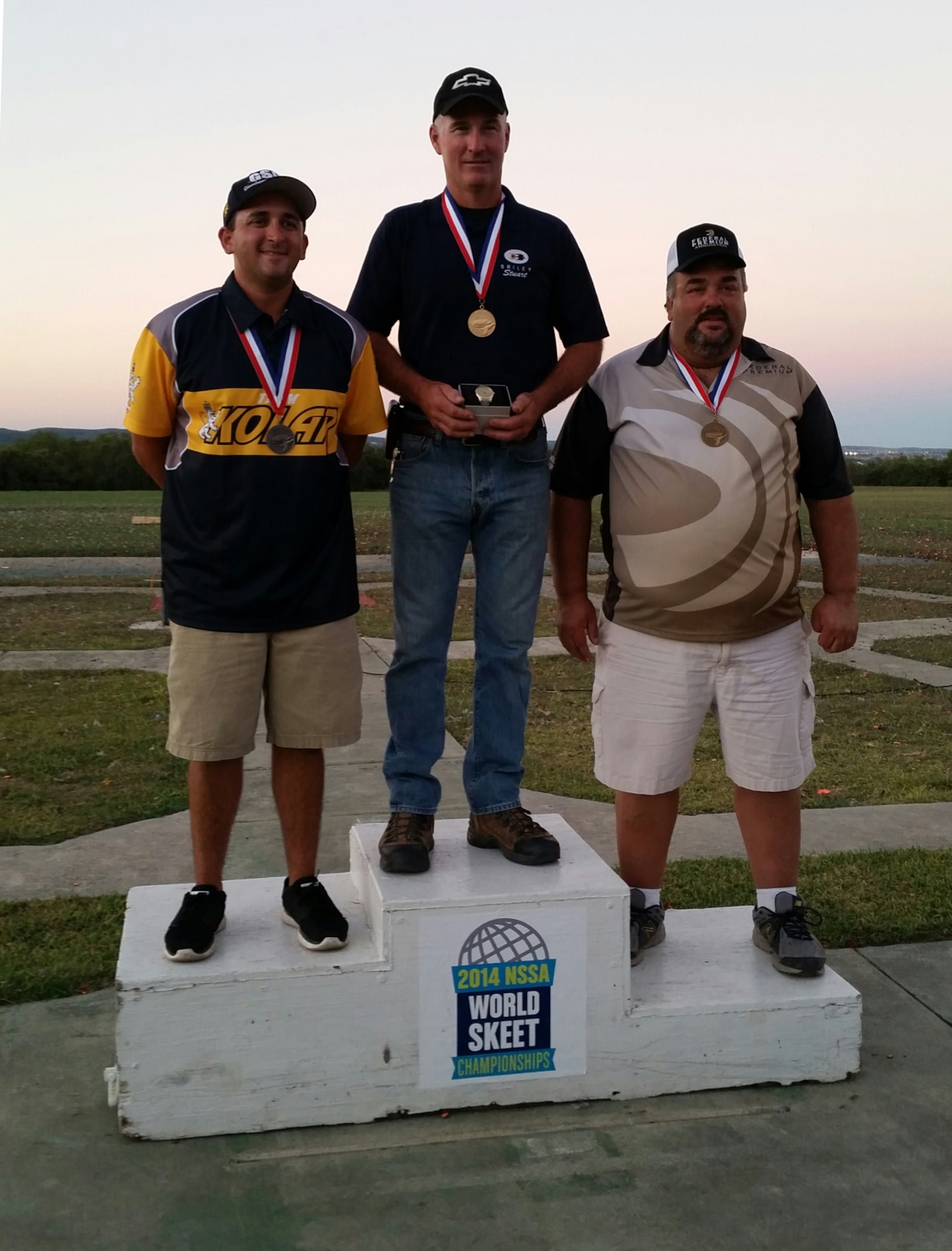 Master Sgt. Stuart Brown (center), 414th Fighter Group F-15E Strike Eagle tactical aircraft maintenance section flight chief, won the high all-around average at the 2014 World Skeet Championships in San Antonio, Texas, Oct. 3, 2014. Brown claimed the top spot by destroying 548 out of 550 targets. (Courtesy photo)
