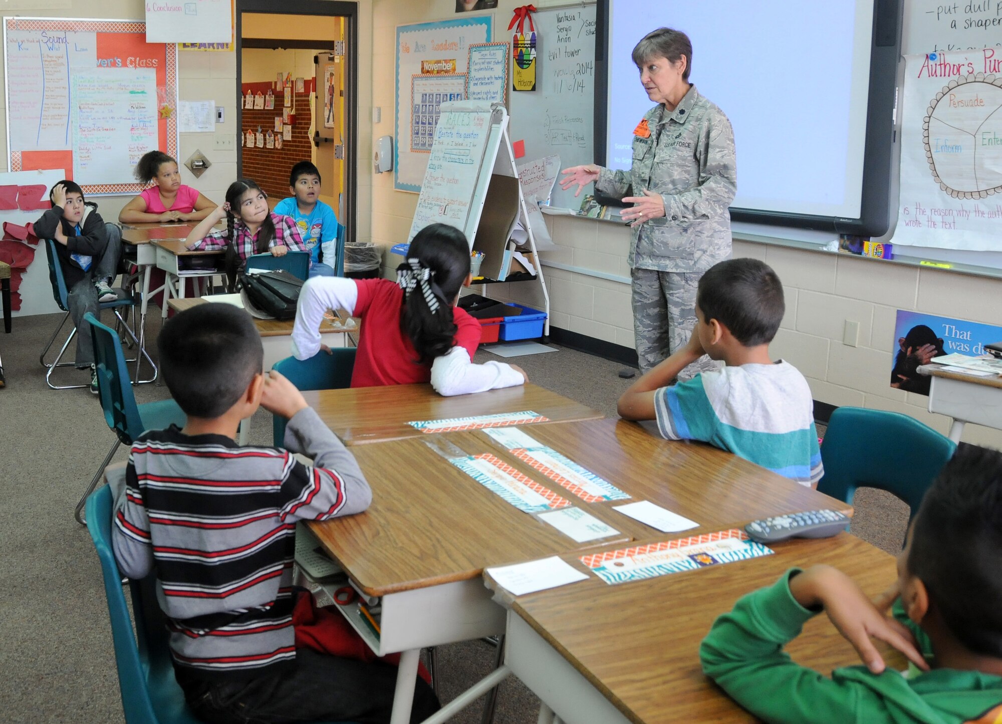 Lt. Col. Judith Mathewson speaks to children during career day at Sutton Elementary in Fort Smith, Ark., Nov. 6, 2014. Mathewson is the 188th Mission Support Group deputy commander. The event was part of the Fort Smith Public School Partners in Education program. (U.S. Air National Guard photo by Airman 1st Class Cody Martin/Released)