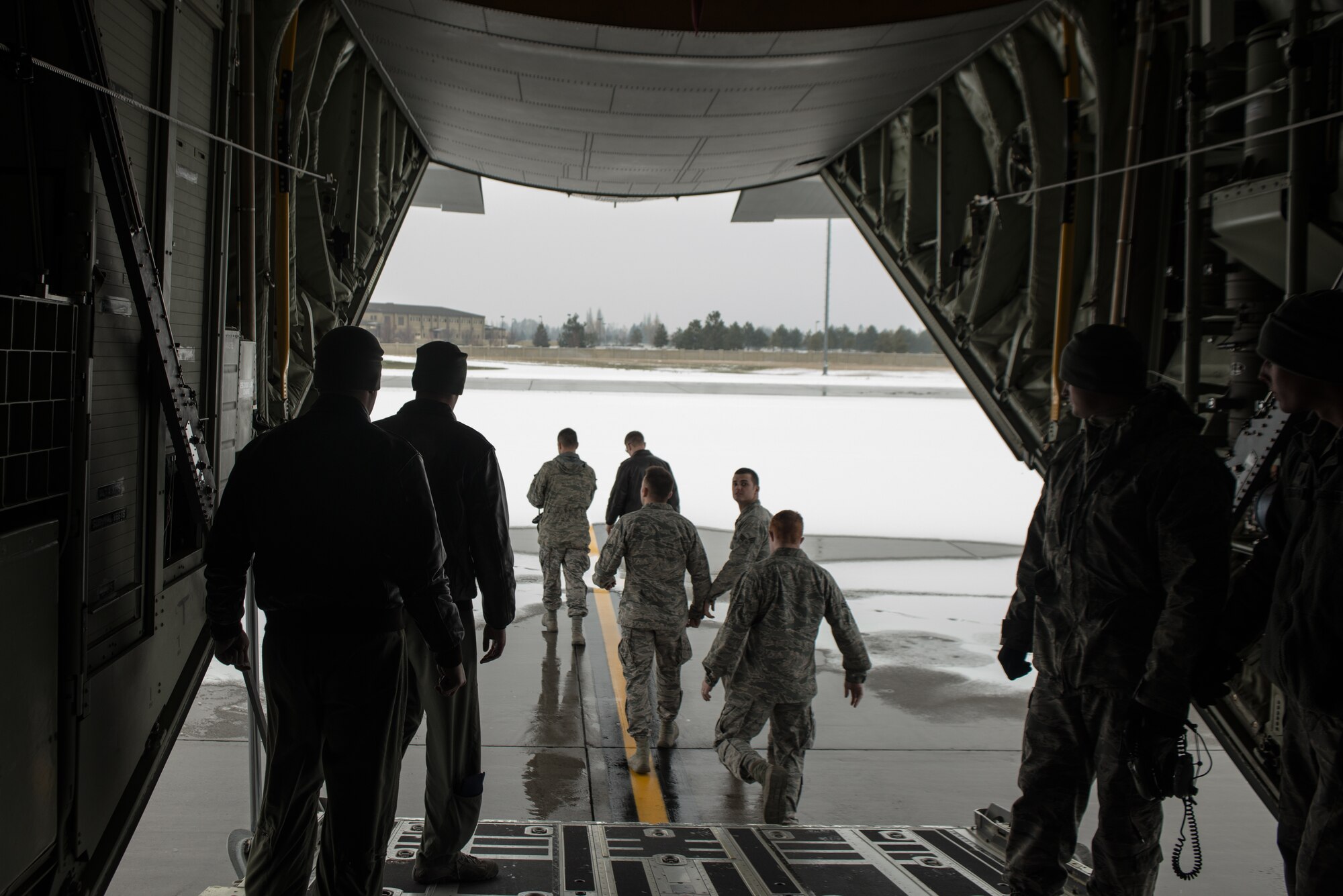 336th Training Group Airmen exit a C-130J Super Hercules aircraft after being given an orientation from the flight crew Nov. 20, 2014 at Fairchild Air Force Base, Wash. Members of the flight crew were part of a training flight from Kirkland AFB, New Mexico, with a loadmaster from Moody AFB, Georgia. (U.S. Air Force photo/Staff Sgt. Alexandre Montes)