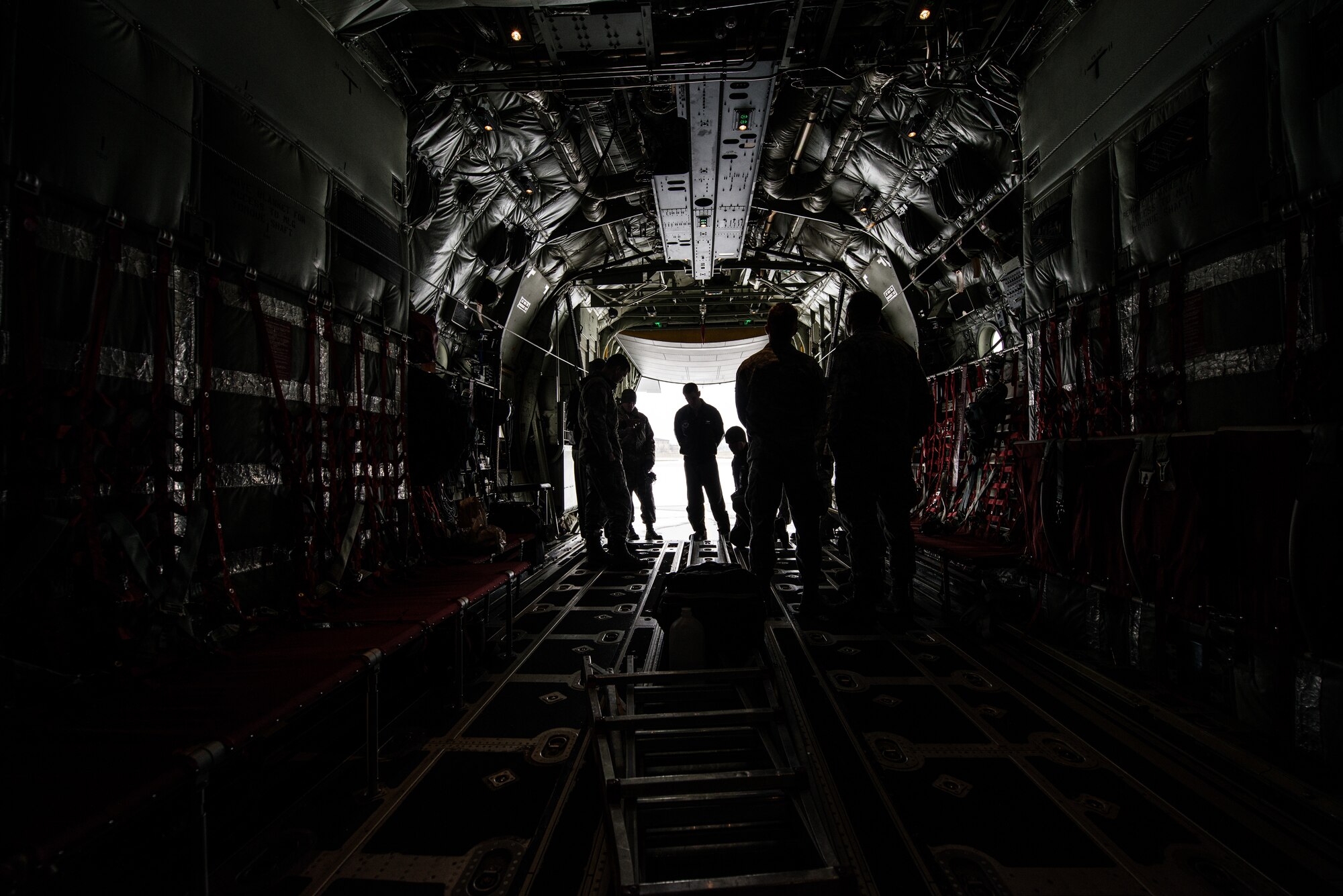336th Training Group Airmen are given a tour inside of a C-130J Super Hercules aircraft Nov. 20, 2014, at Fairchild Air Force Base, Wash. There are 12 different variations of the Lockheed Martin four prop aircraft. Each model differs depending on the mission from air-sea rescue, tactical airlift, weather reconnaissance as well as a civilian version named the LM-100J. (U.S. Air Force photo/Staff Sgt. Alexandre Montes)