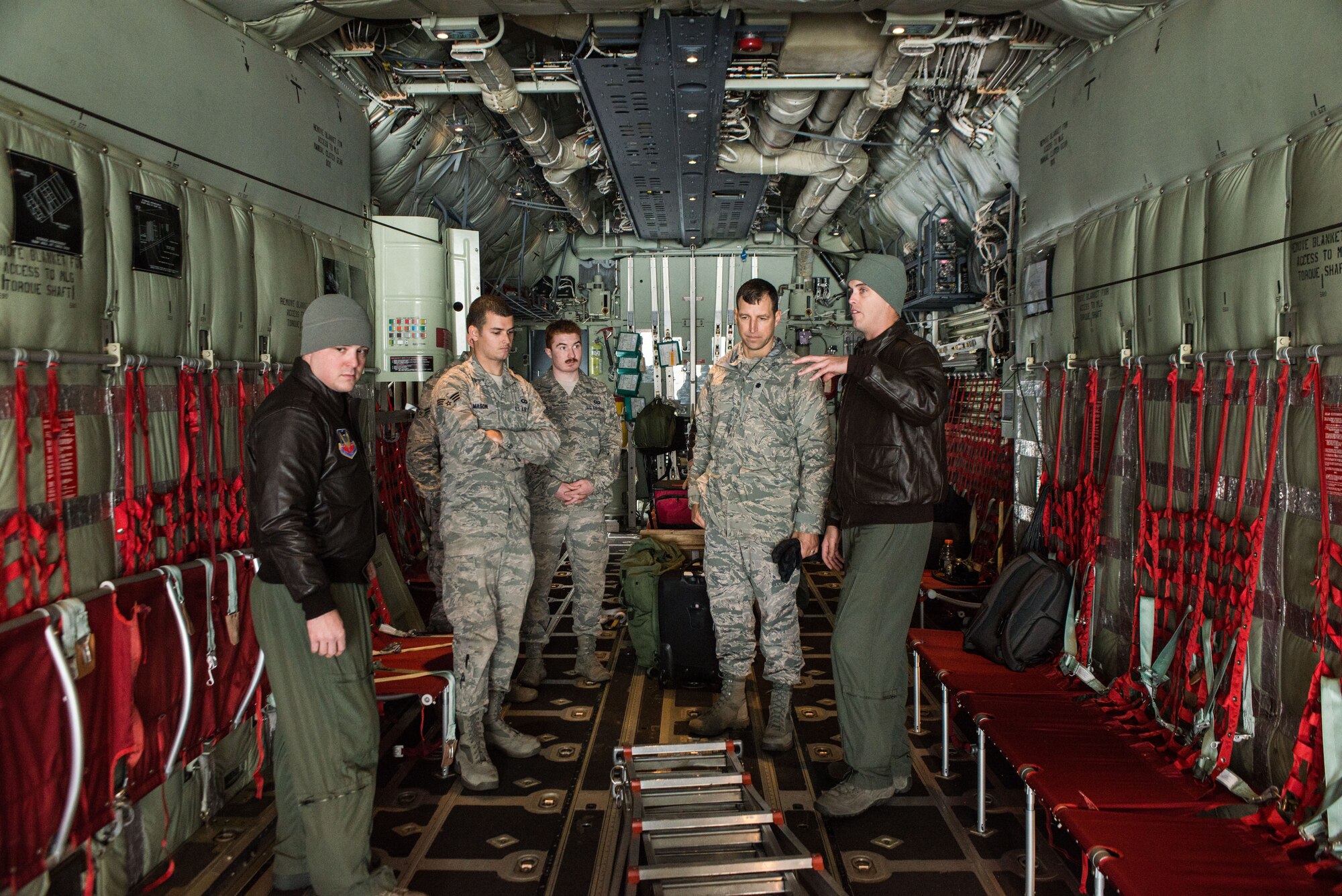 Tech. Sgt. Matthew Jones, 415th Special Operations Squadron, talks to airmen from the 336th Training Support Squadron, about the sequence of events for parachuting out of a C-130J Super Hercules during an orientation Nov. 20, 2014 at Fairchild Air Force Base, Wash. The C-130J is from Kirkland AFB, New Mexico transporting survival evasion resistance escape (SERE) specialist for training. (U.S. Air Force photo/Staff Sgt. Alexandre Montes)