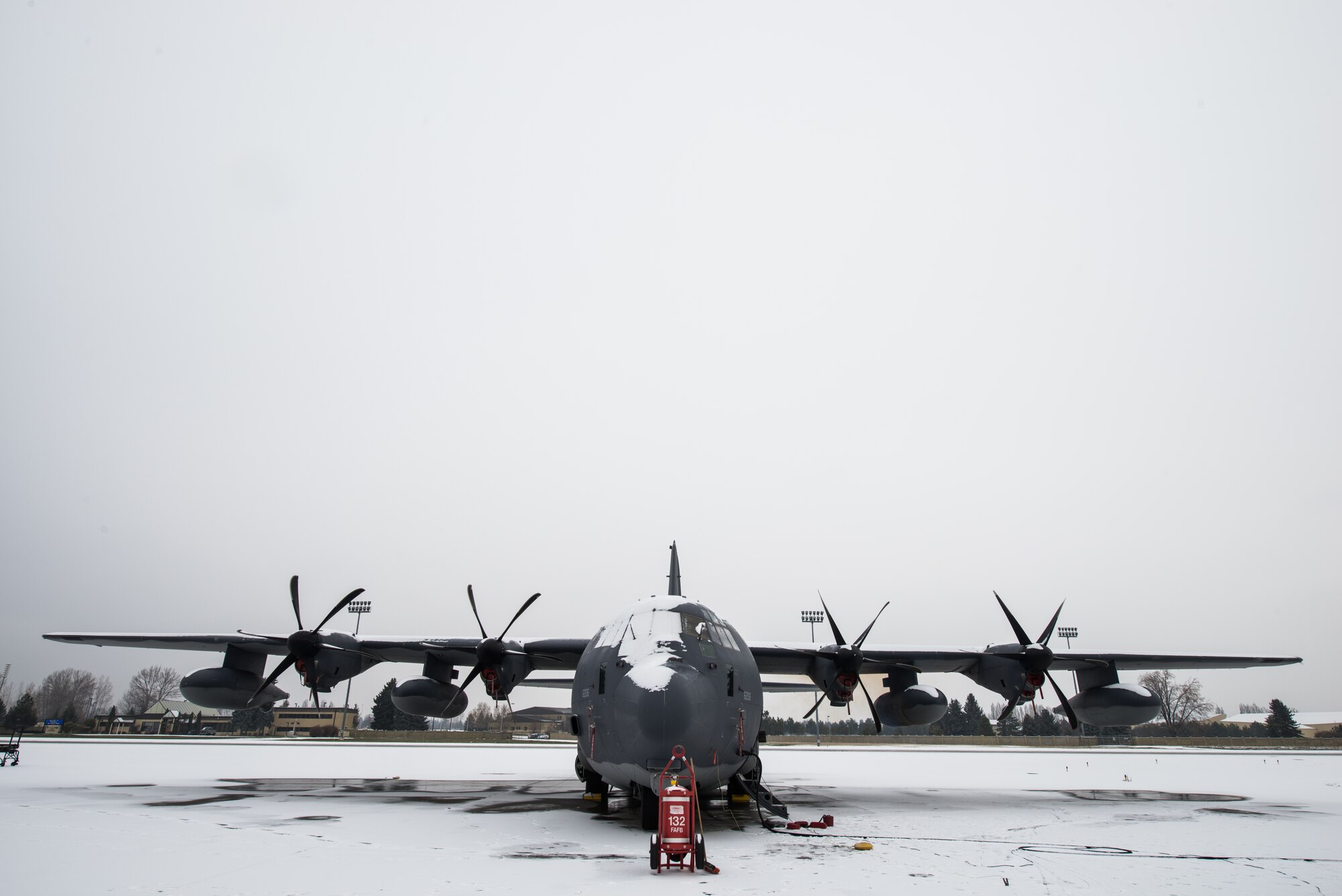 A C-130J Super Hercules is parked on the runway for preflight inspections and de-icing from 92nd Aircraft Maintenance Squadron Airmen Nov. 20, 2014, at Fairchild Air Force Base, Wash. This model of the C-130 family has many updates consisting of newer engines, easy modifications to the bay area and an upgraded flight deck. These modifications allow the aircraft to transform its internal bay from cargo transport to humanitarian relief with no outside support. (U.S. Air Force photo/Staff Sgt. Alexandre Montes) 