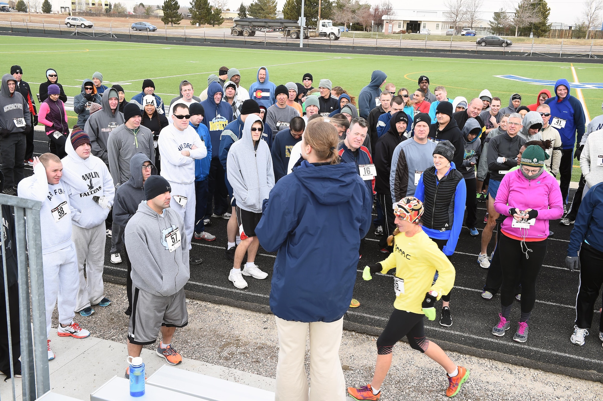 Team Buckley members gather before the eighth annual Turkey Trot 5K Nov. 25, 2014, on Buckley Air Force Base, Colo. The first to finish in each age group won a turkey to cook for Thanksgiving. (U.S. Air Force photo by Airman 1st Class Emily E. Amyotte/Released)