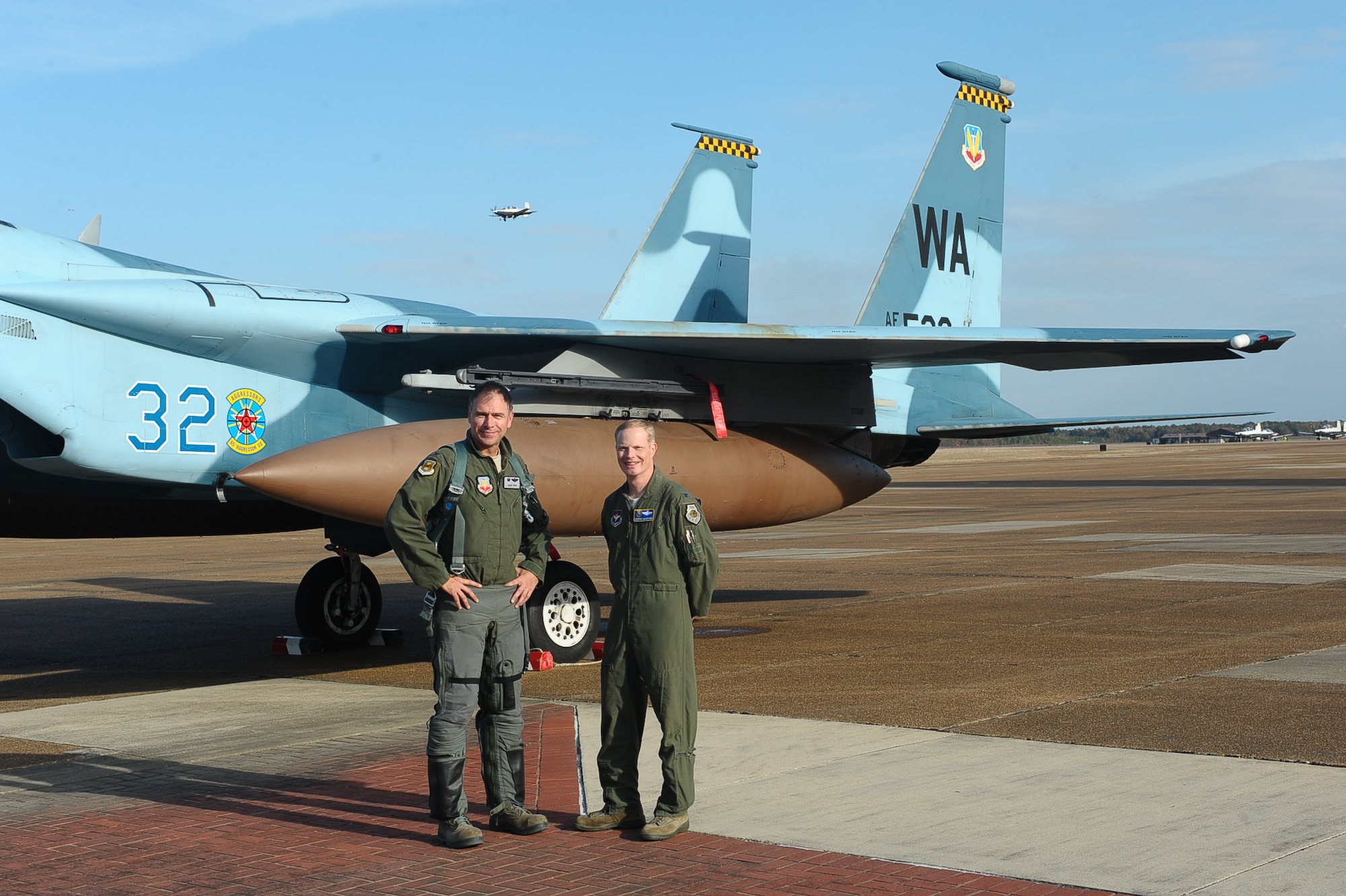 Col. Gary Rose, 57th Adversary Tactics Group Commander, and Col. Howard McArthur, 14th Flying Training Wing Vice Commander, pose for a photo by an F-15C Nov. 20 on Columbus Air Force Base, Miss. Rose inspired student pilots and Airmen alike as the Specialized Undergraduate Pilot Training Class 15-02 graduation speaker during their graduation Nov. 21. (U.S. Air Force photo/Airman Daniel Lile)