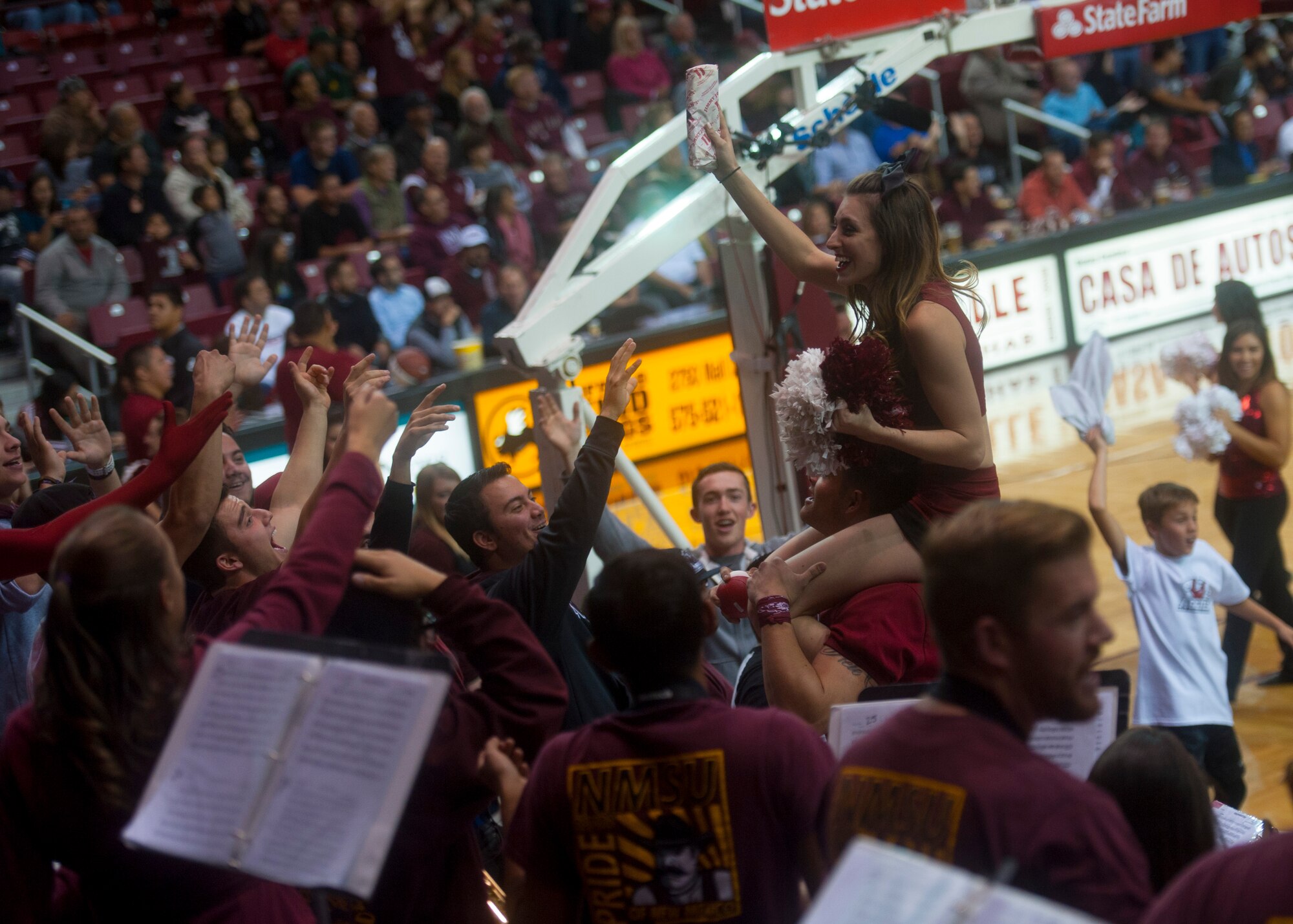 A New Mexico State Aggies energizes the student section during an intermission at the Pan American Center in Las Cruces, N.M., Nov. 19. The Aggies compete in the Western Athletic Conference alongside several other schools in the region. Airmen can drive to the Pan American Center just an hour away from Holloman Air Force Base to enjoy the excitement of a live game atmosphere and to cheer on a team that’s appeared in the NCAA tournament the last three years running. (U.S. Air Force photo by Senior Airman Daniel E. F. Liddicoet/Released)