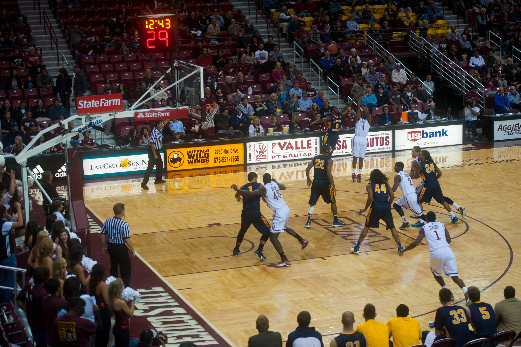 Ian Baker, guard for the New Mexico State Aggies, shoots a three-point jump shot during a matchup with Northern Colorado at the Pan American Center in Las Cruces, N.M., Nov. 19. The Aggies compete in the Western Athletic Conference alongside several other schools in the region. Airmen can drive to the Pan American Center just an hour away from Holloman Air Force Base to enjoy the excitement of a live game atmosphere and to cheer on a team that’s appeared in the NCAA tournament the last three years running. (U.S. Air Force photo by Senior Airman Daniel E. F. Liddicoet/Released)