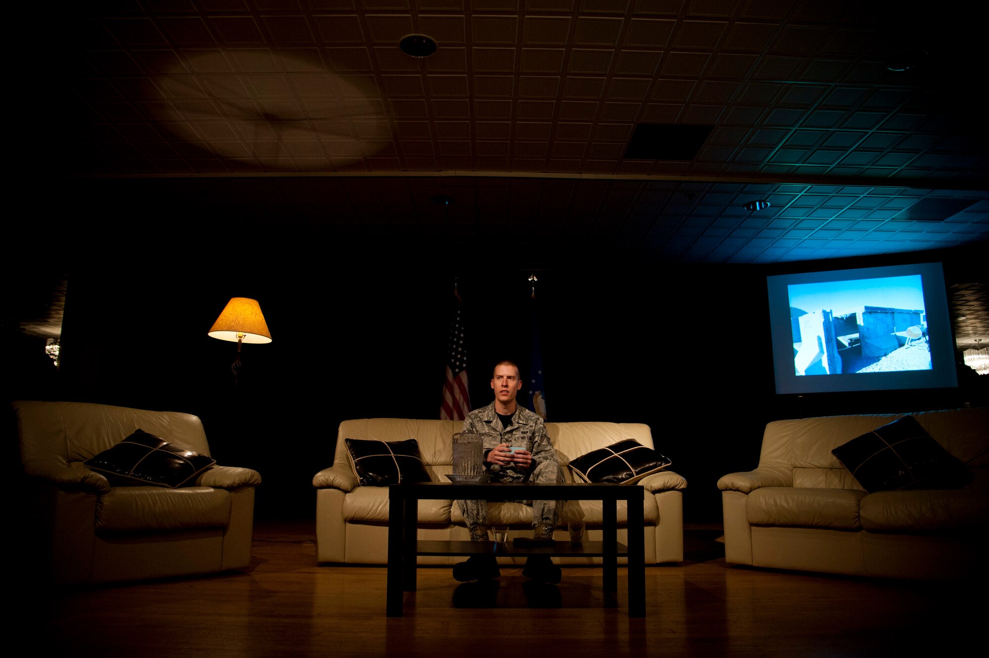 PETERSON AIR FORCE BASE, Colo. – Staff Sgt. Holden Montgomery, Air Force Space Command administrative support technician, tells his story of being diagnosed with post-traumatic stress disorder during Storytellers at the Club, Nov. 21, 2014. Storytellers is a live event where fellow Airmen share their stories of resilience, motivation and professional pride in a relaxing environment that allows the audience to connect and learn. (Air Force photo by Senior Airman Tiffany DeNault)