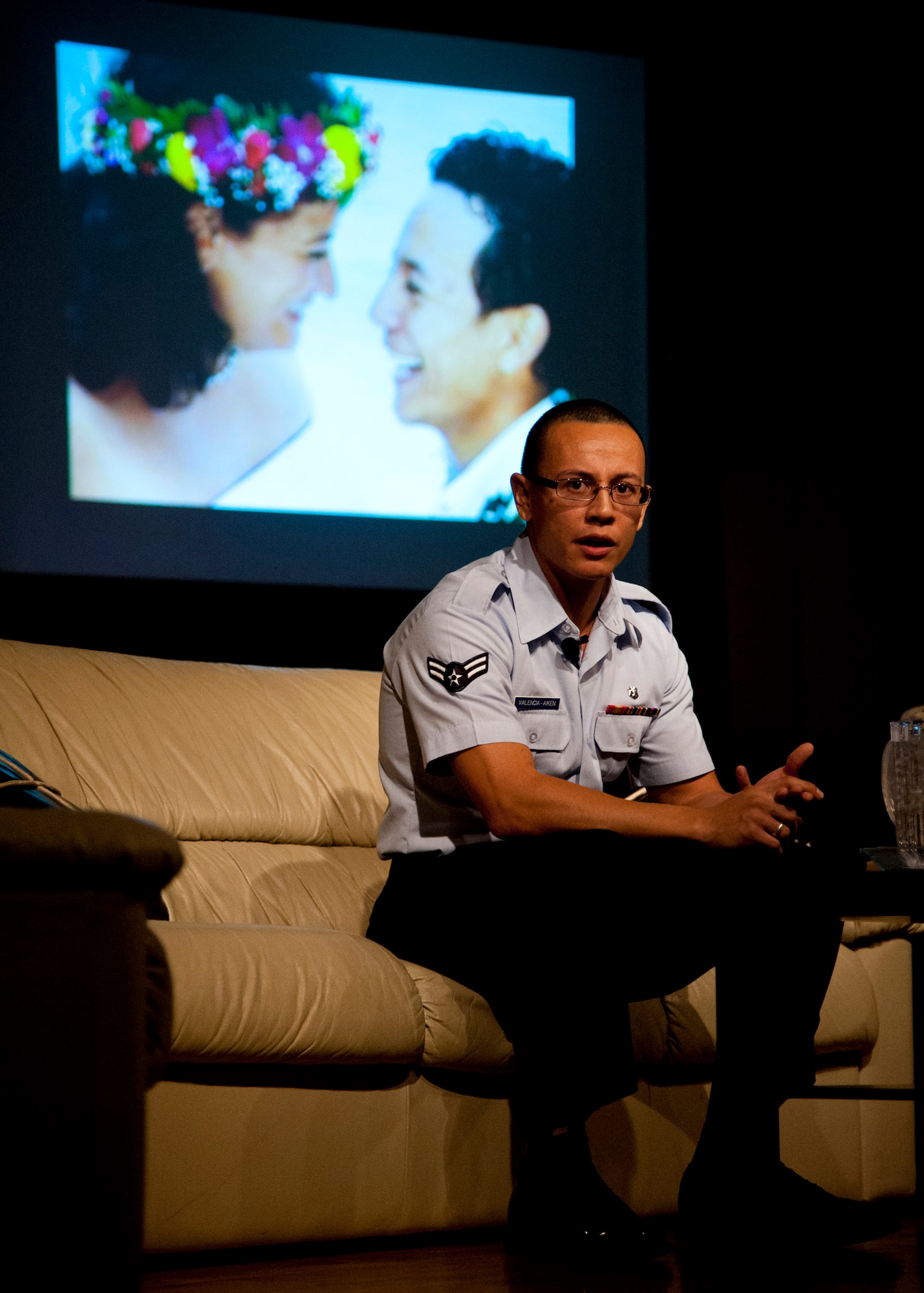 PETERSON AIR FORCE BASE, Colo. – Airman 1st Class Robert Valencia-Aiken, 21st Aerospace Medical Squadron public health technician, tells his story of being adopted at the age of four from Colombia to gaining United States citizenship the day of the Storytellers event at the Club, Nov. 21, 2014. Storytellers is a live event where fellow Airmen share their stories of resilience, motivation and professional pride in a relaxing environment that allows the audience to connect and learn. (Air Force photo by Senior Airman Tiffany DeNault)