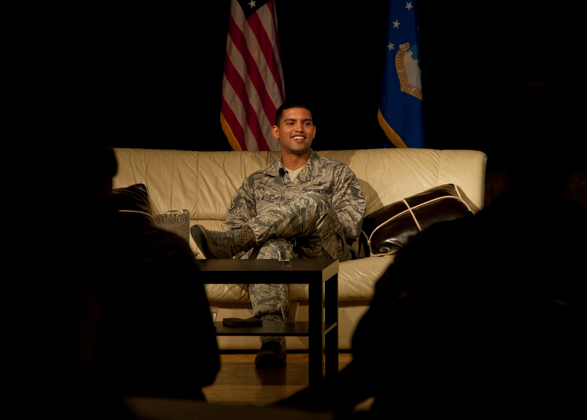 PETERSON AIR FORCE BASE, Colo. – Staff Sgt. Danniel DeJesus, North American Aerospace Defense Command intelligence analyst, tells his story of divorce and child custody battles during Storytellers at the Club, Nov. 21, 2014. Storytellers is a live event where fellow Airmen share their stories of resilience, motivation and professional pride in a relaxing environment that allows the audience to connect and learn. (Air Force photo by Senior Airman Tiffany DeNault)