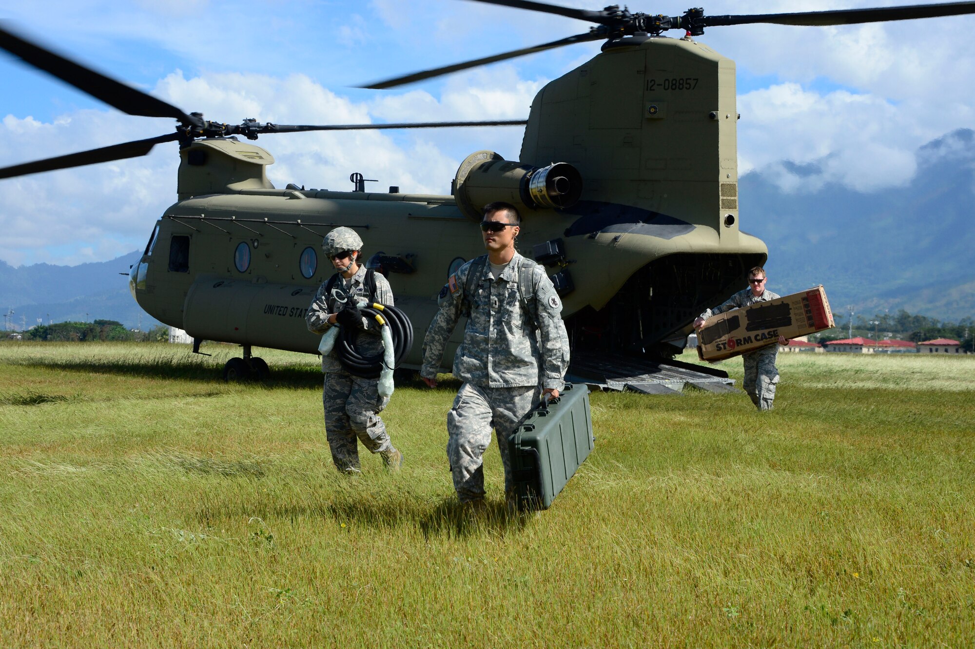 Members from the Joint Task Force-Bravo U. S. Southern Command Situational Assessment Team unload equipment from a CH-47 Chinook during air load and fly-away training on Soto Cano Air Base, Honduras, Nov. 25, 2014.  The members of the S-SAT received training on setting up a Pre-Positioned Expeditionary Assistance Kit to help prepare the team respond efficiently to humanitarian assistance and disaster response situations throughout U.S. Southern Command’s area of responsibility.  The PEAK is designed to provide sustainable, essential services in the first 72 hours after a disaster event. The training focused on S-SAT familiarization, hands on training and a fly-away event between JTF-Bravo S-SAT personnel, Army Forces Battalion, and 1-228th Aviation Regiment in preparation for an upcoming exercise.  (U.S. Air Force photo/Tech. Sgt. Heather Redman)
