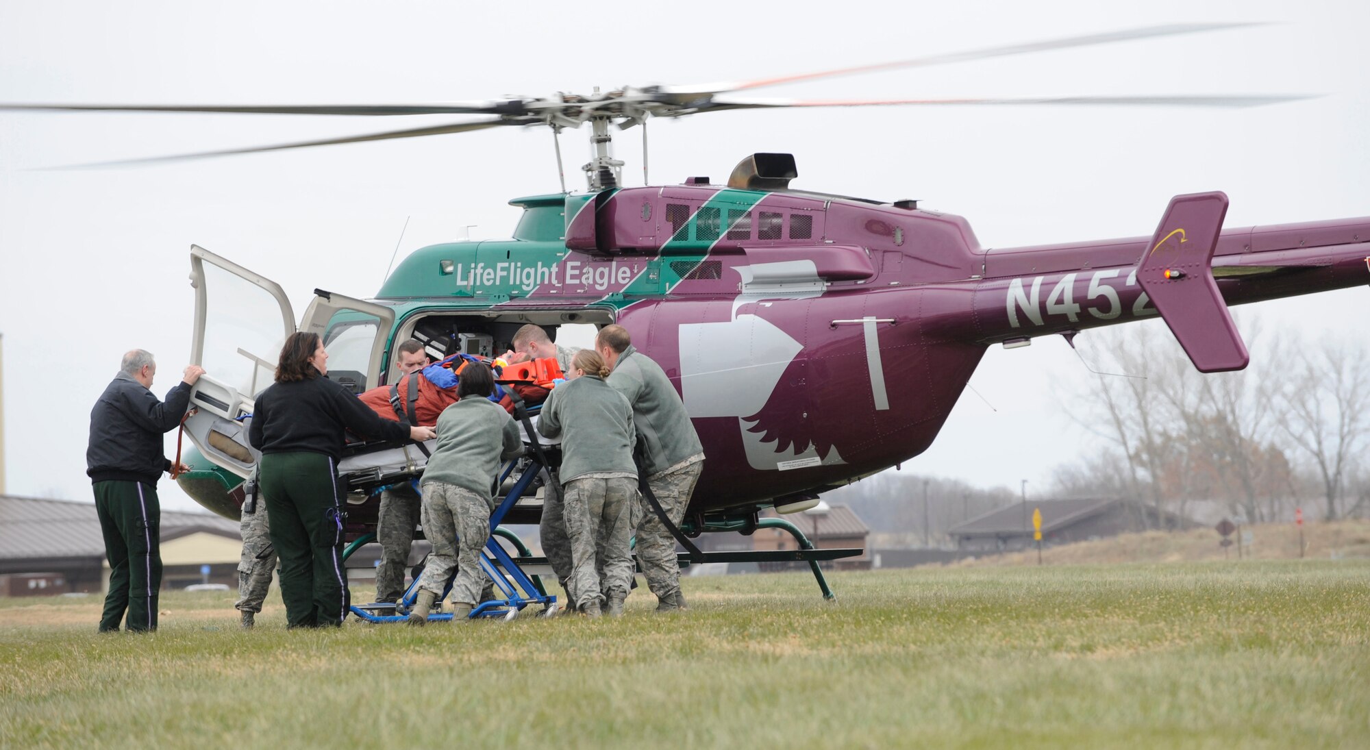 WHITEMAN AIR FORCE BASE, MO—Members of the 509th Medical Group and local emergency responders prepare to send a patient to a local hospital during a motor vehicle accident exercise at Whiteman Air Force Base, Mo., Nov. 21, 2014. The exercise was a joint effort between the 509th Medical Group, 509th CES Firefighters, Johnson County Ambulance District, and Life Flight Medical Air Ambulance Services. (U.S. Air Force photo by Staff Sgt. Alexandra M. Boutte/Released)