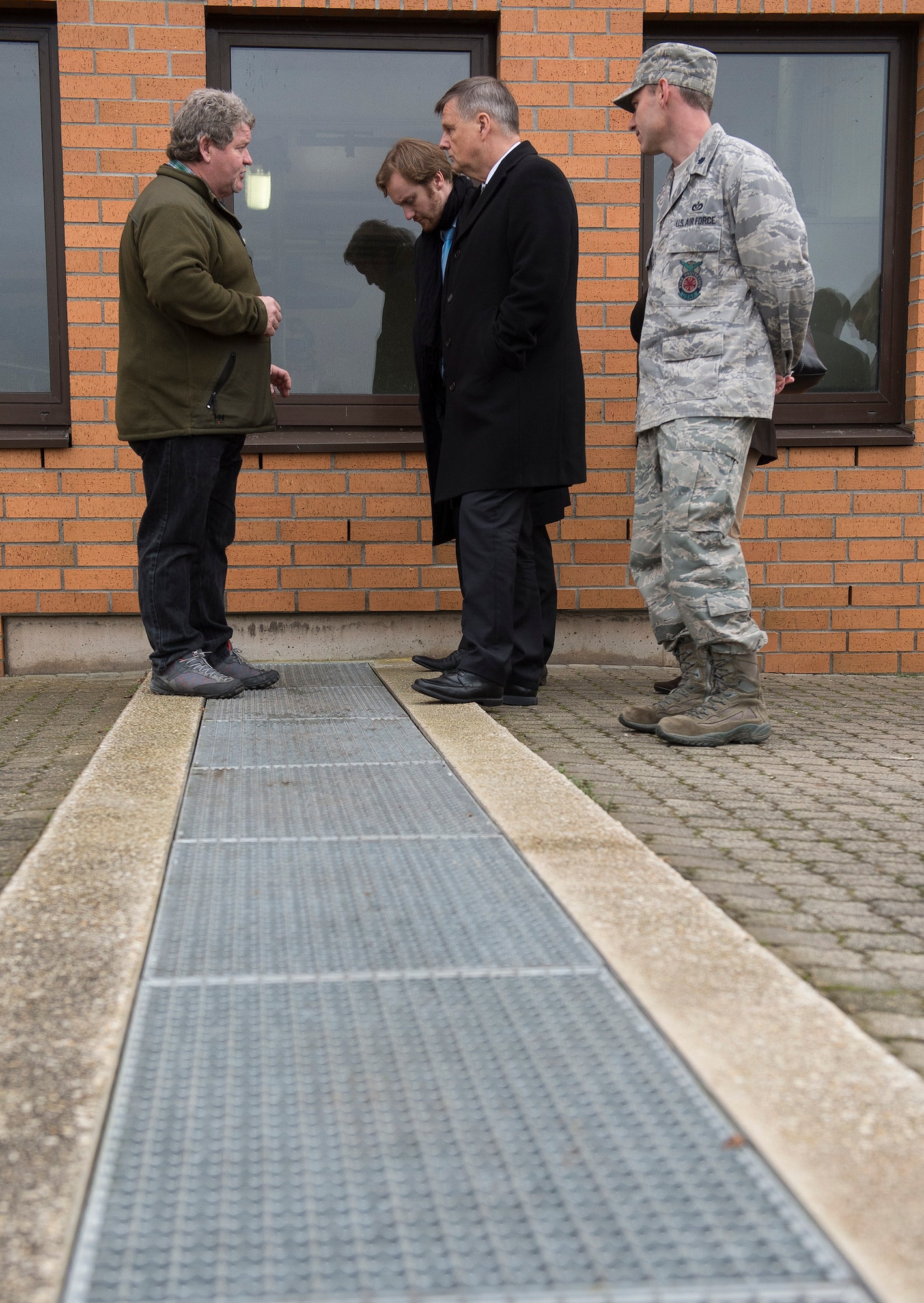 Peter Thiel, 52nd Civil Engineer Squadron waste water treatment foreman, left, and U.S. Air Force Lt. Col. Christopher Meeker, 52nd CES commander, right, discuss water treatment procedures with Dr. Ulrich Kleemann, SGD-Nord president, center, at the waste water plant near Spangdahlem Air Base, Germany, Nov. 20, 2014. SGD-Nord, the environmental protection organization for the Rhineland-Pfalz region, acts as a field agency that reports directly to the state ministries, and oversees regional project planning, environmental compliance issues, water drainage, nature conservation, land acquisition and compensation issues, building standards control and redevelopment of hazardous waste sites. Base leaders invited Kleemann on a tour to discuss the wing’s continuing commitment to responsible stewardship of the environment and prospects for partnering with SGD-Nord. (U.S. Air Force photo by Staff Sgt. Chad Warren/Released)