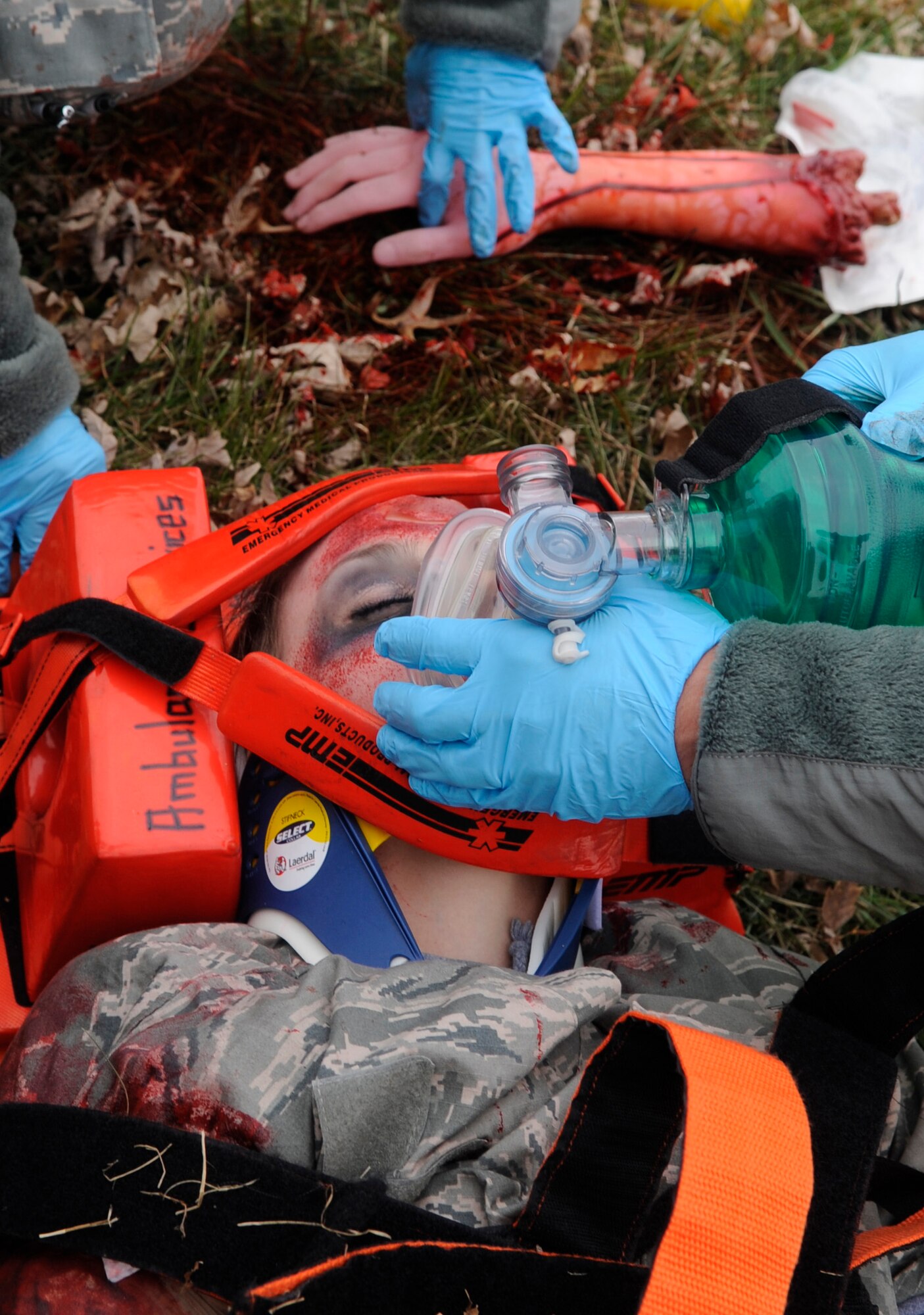 WHITEMAN AIR FORCE BASE, MO—Senior Airman Krista Kollias, 509th Medical Operations Squadron, is being resuscitated with a bag-valve-mask, a motor vehicle accident exercise at Whiteman Air Force Base, Mo., Nov. 21, 2014. During the exercise, three individuals were injured and one was simulated to be transported in a helicopter to a local hospital. (U.S. Air Force photo by Staff Sgt. Alexandra M. Boutte/Released)