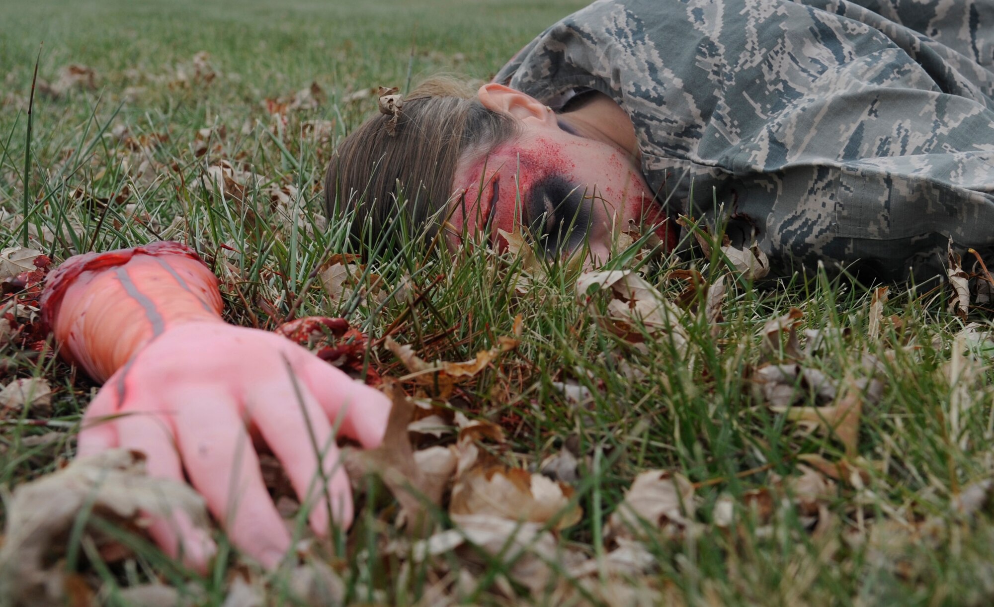 WHITEMAN AIR FORCE BASE, MO-Senior Airman Krista Kollias, 509th Medical Operations Squadron, was moulaged as an amputee patient during a motor vehicle accident exercise at Whiteman Air Force Base, Mo., Nov. 21, 2014. The purpose of the training was to improve response time and treatment for victims, as well as coordinate patient transport with community partners. The 509th Medical Group, 509th CES Firefighters, Johnson County Ambulance District, and Life Flight participated in the exercise.  (U.S. Air Force photo by Staff Sgt. Alexandra M. Boutte/Released)
