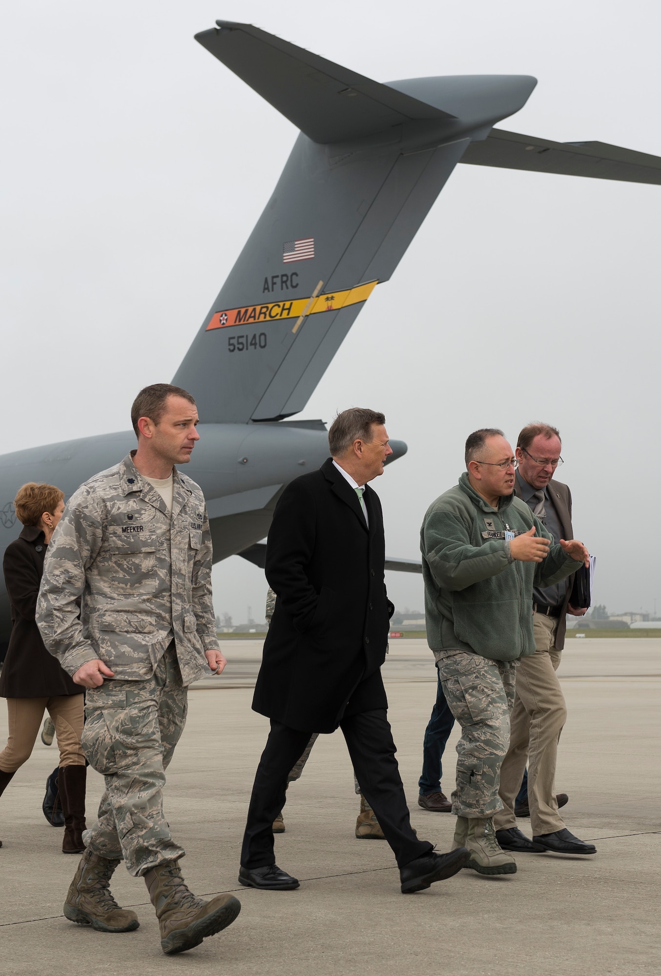 Base members escort Dr. Ulrich Kleemann, SGD-Nord president, on the flightline of Spangdahlem Air Base, Germany, Nov. 20, 2014. SGD-Nord, the environmental protection organization for the Rhineland-Pfalz region, acts as a field agency that reports directly to the state ministries, and oversees regional project planning, environmental compliance issues, water drainage, nature conservation, land acquisition and compensation issues, building standards control and redevelopment of hazardous waste sites. Base leaders invited Kleemann on a tour to discuss the wing’s continuing commitment to responsible stewardship of the environment and prospects for partnering with SGD-Nord. (U.S. Air Force photo by Staff Sgt. Chad Warren/Released)