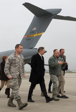 Base members escort Dr. Ulrich Kleemann, SGD-Nord president, on the flightline of Spangdahlem Air Base, Germany, Nov. 20, 2014. SGD-Nord, the environmental protection organization for the Rhineland-Pfalz region, acts as a field agency that reports directly to the state ministries, and oversees regional project planning, environmental compliance issues, water drainage, nature conservation, land acquisition and compensation issues, building standards control and redevelopment of hazardous waste sites. Base leaders invited Kleemann on a tour to discuss the wing’s continuing commitment to responsible stewardship of the environment and prospects for partnering with SGD-Nord. (U.S. Air Force photo by Staff Sgt. Chad Warren/Released)