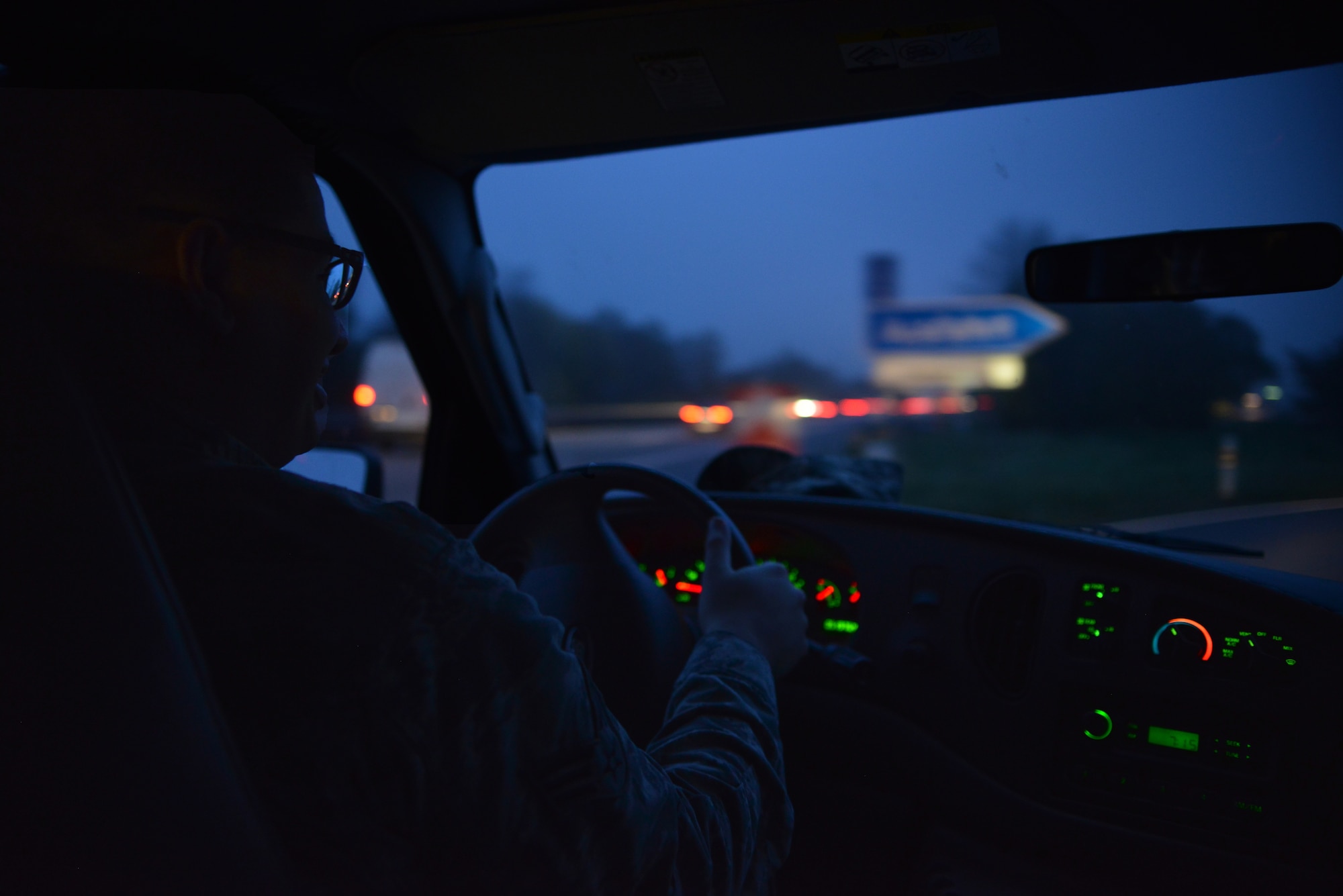 Senior Airman Michael Fromme, Contingency Aeromedical Staging Facility medical technician, drives to Landstul Regional Medical Center to assist his fellow Airmen pick up patients and baggage, Nov. 20, 2014. Arriving at work in the morning, Airmen from the CASF are dedicated to ensuring their mission runs smooth. (U.S. Air Force photo/Senior Airman Hailey Haux)