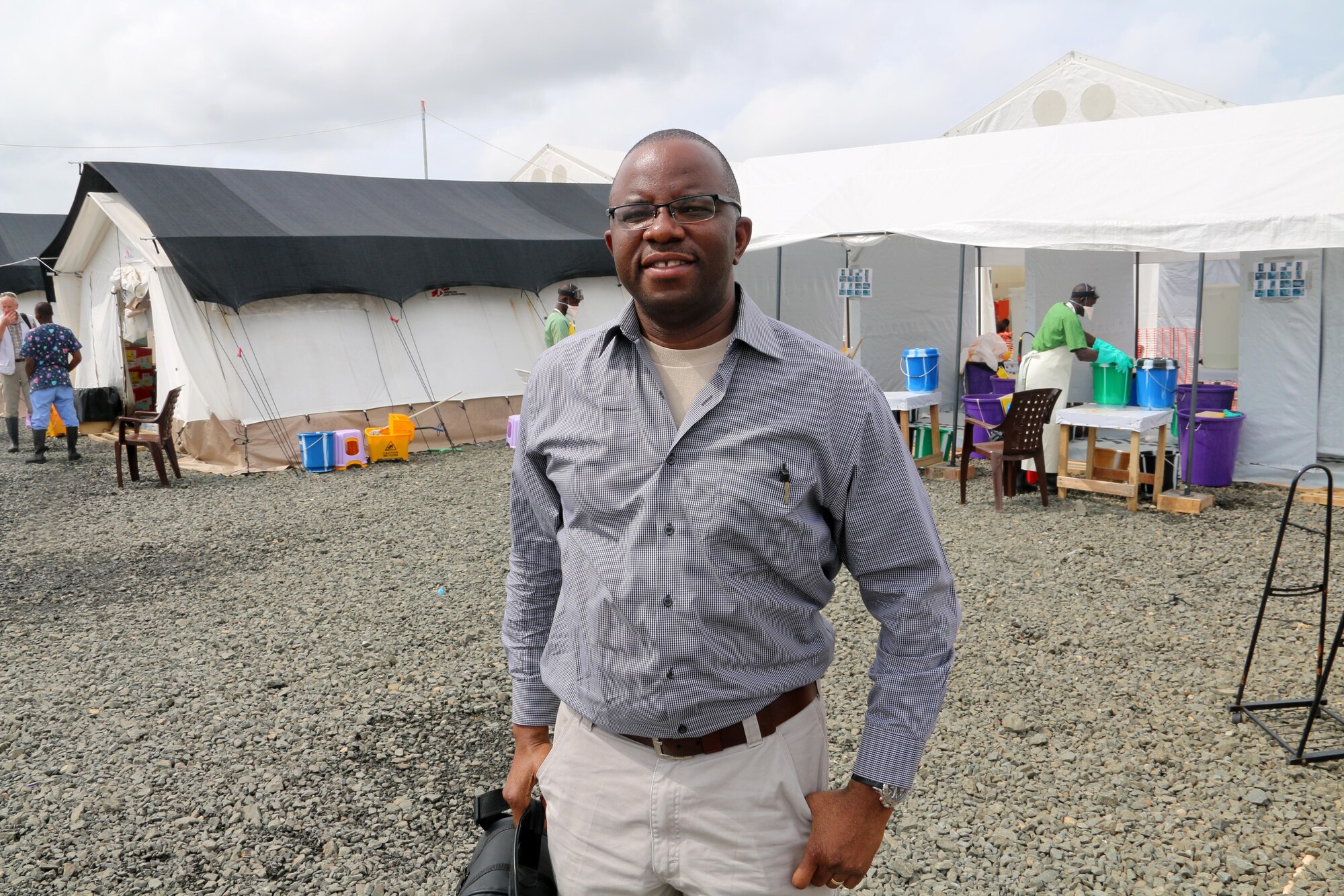 MONROVIA, Liberia – Maj. Francis Obuseh, U.S. Air Forces in Europe and Air Forces Africa Surgeon General’s Office epidemiologist and international health specialist, poses for a photo at a field hospital in Monrovia, Liberia Sept. 19, 2014. Obuseh was sent to Liberia to conduct a site survey for a field hospital to be used in the fight against the epidemic Ebola outbreak there. (Courtesy photo)