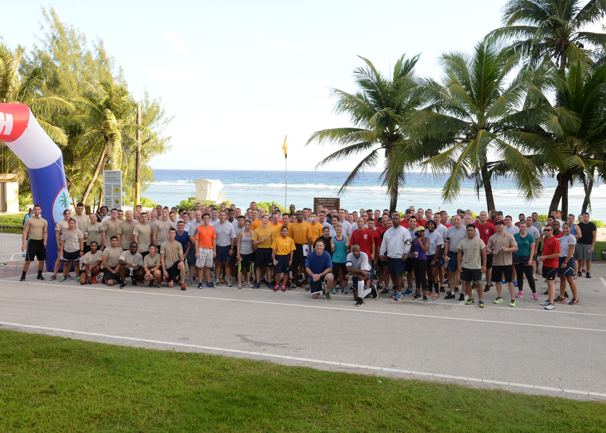 Participants of the 2014 Gobble Wobble 5K Fun Run gather together for a group photo after the event at Tarague Beach at Andersen Air Force Base, Guam. Approximately 100 people participated in the Gobble Wobble as part of the monthly 5K event conducted by Coral Reef Fitness Center Airmen. (U.S. Air Force photo by Senior Airman Katrina M. Brisbin/Released)