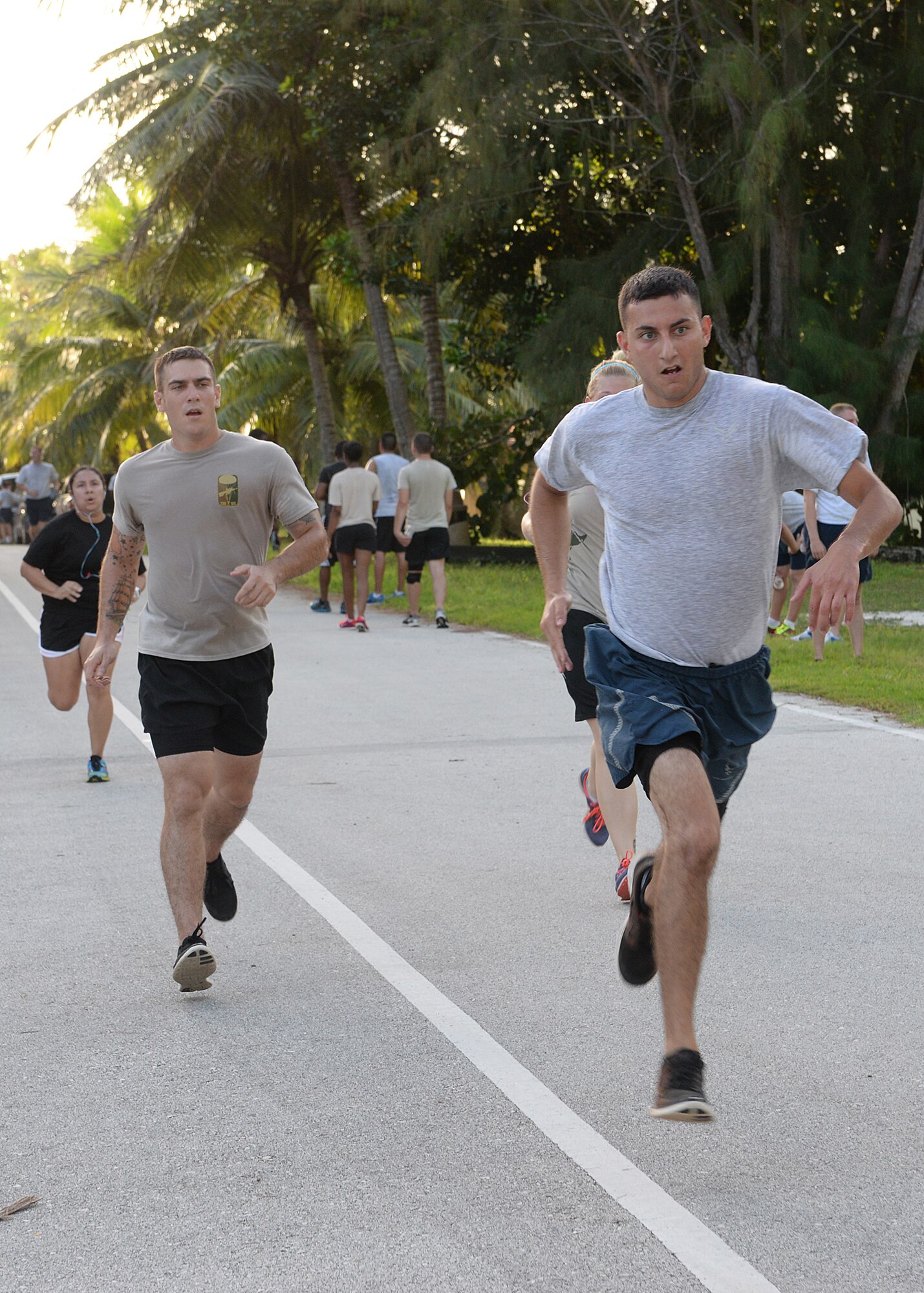 Team Andersen Airmen race to the finish line during the 2014 Gobble Wobble 5K Fun Run Nov. 26, 2014, at Tarague Beach at Andersen Air Force Base, Guam. Airmen participated in the event to build resiliency by focusing on the Comprehensive Airman Fitness pillar of physical fitness. (U.S. Air Force photo by Senior Airman Katrina M. Brisbin/Released)