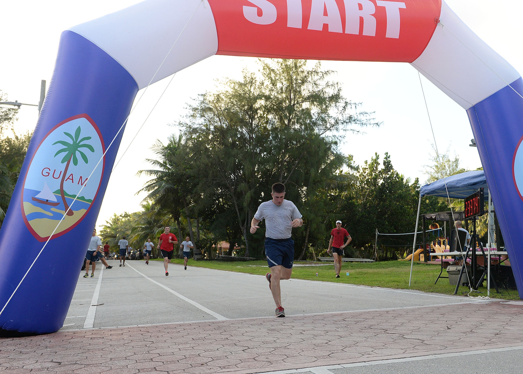 Team Andersen Airmen race to the finish line during the 2014 Gobble Wobble 5K Fun Run Nov. 26, 2014, at Tarague Beach at Andersen Air Force Base, Guam. Airmen participated in the event to build resiliency by focusing on the Comprehensive Airman Fitness pillar of physical fitness. (U.S. Air Force photo by Senior Airman Katrina M. Brisbin/Released)