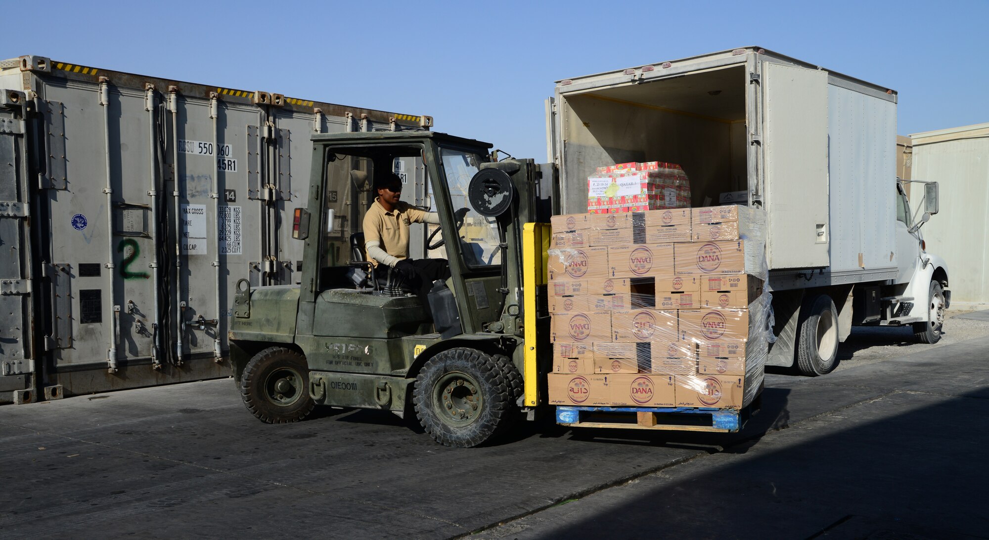 Boxes of food and drinks are unloaded for the annual Thanksgiving meal, Nov. 27, 2014, at Al Udeid Air Base, Qatar. More than a couple thousand pounds of food was ordered for deployed servicemembers to enjoy, which included more than 400 turkeys.  (U.S. Air Force photo by Senior Airman Kia Atkins)