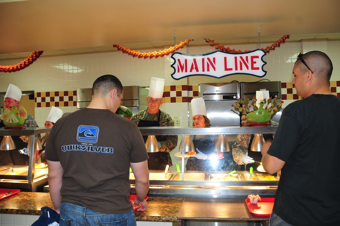 U.S. Marine General  John Kelly, Commander, U.S. Southern Command, serves stuffing to a Joint Task Force-Bravo service member during a Thanksgiving meal here, Nov. 27, 2014.  General Kelly visited the service members of JTF-Bravo to thank them for their service, hard work, and to wish them a happy Thanksgiving Day. (U.S. Air Force photo by Capt. Connie Dillon)