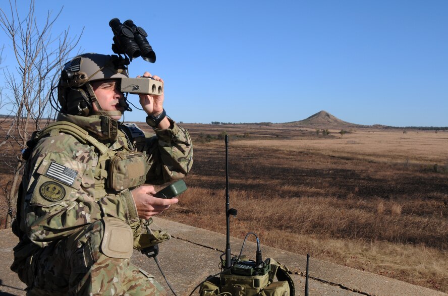 Tech. Sgt. Robert G. Ellis II scans the horizon at 188th Wing Detachment 1 Razorback Range at Fort Chaffee Joint Maneuver Training Center, Ark., Nov. 6, 2014. Ellis was selected as The Flying Razorback spotlight for December 2014. Ellis is the 188th’s joint terminal attack controller (JTAC) trainer. He trains Special Operations JTACs from every branch to ensure they maintain their certifications and they’re prepared for future combat deployments. (U.S. Air National Guard photo by Airman 1st Class Cody Martin/Released)