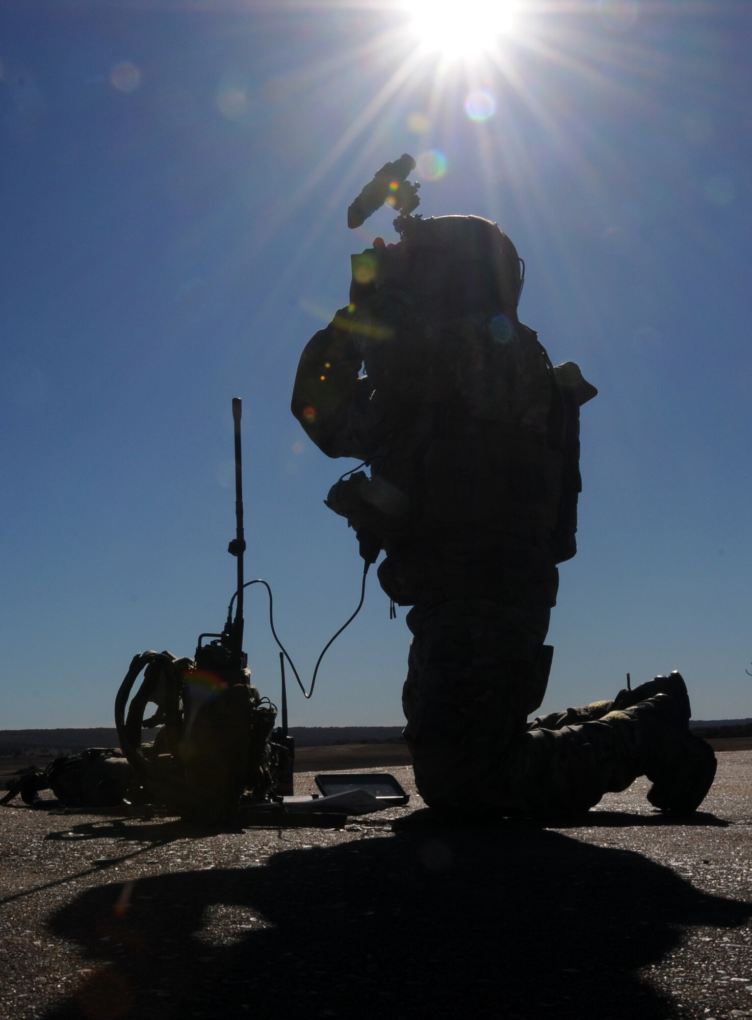 Tech. Sgt. Robert G. Ellis II scans the horizon at 188th Wing Detachment 1 Razorback Range at Fort Chaffee Joint Maneuver Training Center, Ark., Nov. 6, 2014. Ellis was selected as The Flying Razorback spotlight for December 2014. Ellis is the 188th’s joint terminal attack controller (JTAC) trainer. He trains Special Operations JTACs from every branch to ensure they maintain their certifications and they’re prepared for future combat deployments. (U.S. Air National Guard photo by Airman 1st Class Cody Martin/Released)