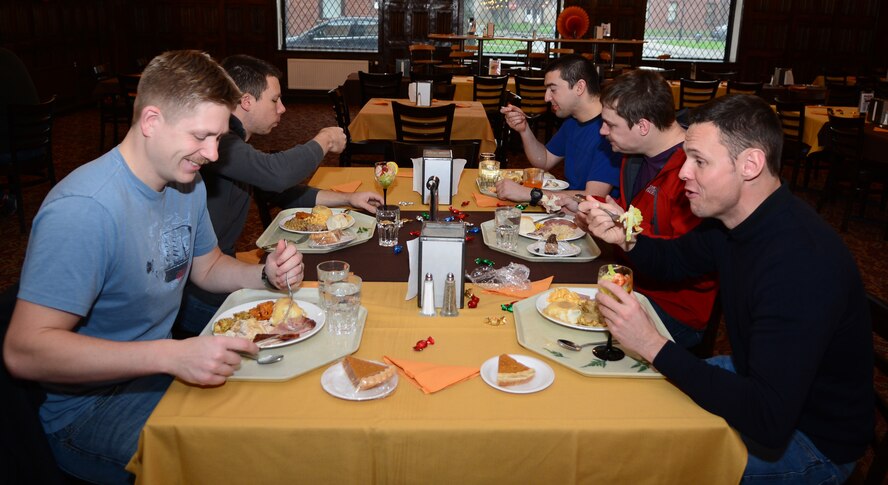 Team Mildenhall members enjoy a Thanksgiving meal Nov. 27, 2014, at the Gateway Dining Facility on RAF Mildenhall, England. The special meal was prepared in celebration of the American holiday and fed more than 250 members of Team Mildenhall. (U.S. Air Force photo by Airman 1st Class Jonathan Light/Released)