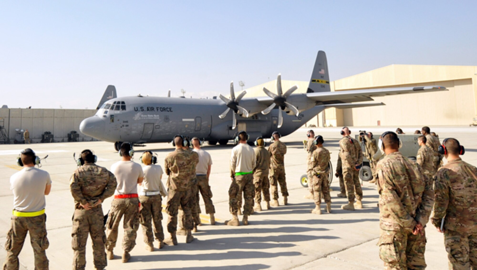 U.S. Air Force Airmen assigned to the 455th Expeditionary Aircraft Maintenance Squadron’s Aircraft Maintenance Unit watch as a C-130J prepares for takeoff in Black Letter Initial status Nov. 12, 2014 at Bagram Airfield, Afghanistan. Black Letter Initial, an extreme rarity in the maintenance realm, indicates the send-off of an aircraft with zero discrepancies. (U.S. Air Force photo by Capt. Jennifer Bosco/released)