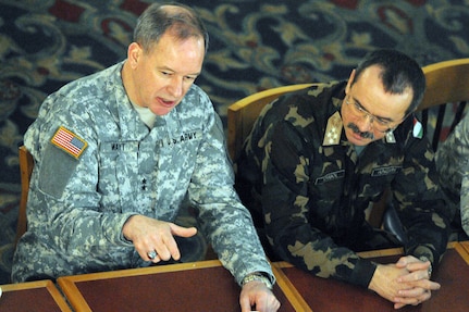 Army Maj. Gen. Gregory L. Wayt, adjutant general of the Ohio National Guard, talks to Hungarian Chief of Defense Gen. Lazlo Tombol during breakfast at the Embassy Suites hotel in Dublin, Ohio Feb. 27, 2010. Wayt and Tombol addressed Ohio National Guard leaders during the 2010 Ohio National Guard Commanders Call.