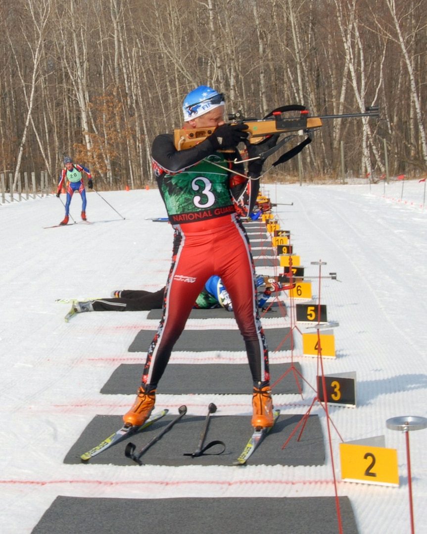 Sgt. 1st Class Kent Pulst of the North Dakota National Guard prepares to fire on targets in the relay race at the Chief of the National Guard Bureau Biathlon Championships held at Camp Ripley, Minn., March 7, 2010.