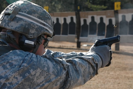 Sgt. Gerald Acuna of Team California fires his weapon during the Pistol Excellence-in-Competition Match during the All-Army Championships at Fort Benning, Ga., held Feb. 21-27, 2010.