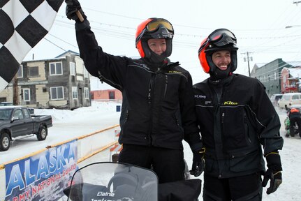 Warrant Officer Rick Fleming, right, and Staff Sgt. Elaine Jackson smile after finishing the trail class portion of the 2010 Iron Dog. They represented the Alaska National Guard on the trail from Big Lake to Nome in the trail class portion of the 2010 Iron Dog race, finishing in third place.