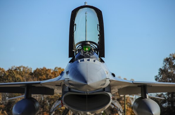Capt. Roy Poor III opens the canopy of an F-16C Fighting Falcon Nov. 24, 2014, at Little Rock Air Force Base, Ark. Poor landed there to refuel before making his way back to Toledo Air National Guard Base, Ohio. Poor is a 180th Fighter Wing F-16 pilot. (U.S. Air Force photo/Airman 1st Class Harry Brexel)