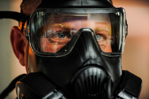 Tech. Sgt. Christopher Genuardi goes through breathing techniques during a gas mask fit test Nov. 21, 2014, at Incirlik Air Base, Turkey. The fit test is used to ensure the mask will work properly during emergency situations.  Genuardi is a 39th Civil Engineer Squadron heating, ventilation and air conditioning section chief. (U.S. Air Force photo/Airman Cory W. Bush)