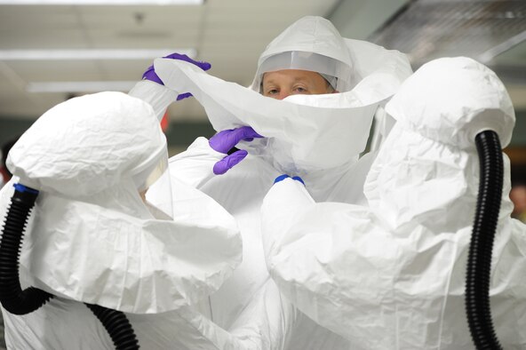 A medical support team augmentation class trains on Joint Base San Antonio-Fort Sam Houston, Texas, Nov. 18, 2014. U.S. military members learned how to use Personal Protective Equipment and proper procedures when working in areas contaminated with the Ebola virus. The class was part of a weeklong training hosted by U.S. Army North (Fifth Army), to enhance the skills of first responders. (U.S. Air Force photo/Senior Airman Westin Warburton)