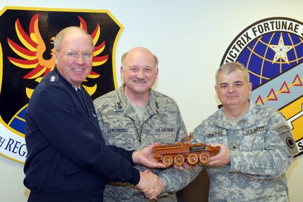 Maj. Gen. Timothy J. Lowenberg, the adjutant general of Washing ton, and
Brig. Gen. Jeff Mathis, the acting commander of I Corps at Fort Lewis,
Wash., present a model Stryker vehicle to Gen. Craig R. McKinley, the chief
of the National Guard Bureau at Camp Murray, Wash., March 10, 2010. The
conversion of the 81st Heavy Brigade Combat Team of the Washington Army Guard into a Stryker BCT was one of the main topics of discussion.