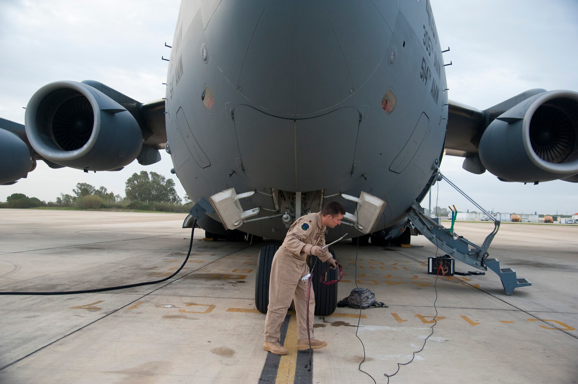 U.S. Air Force Maj. Brant Dixon, 817th Global Mobility Readiness Squadron Operations Officer and C-17 Globemaster III Instructor Pilot, commands a special two-part flying mission with the 6th Airlift Squadron, Joint Base McGuire-Dix-Lakehurst, N.J. Nov. 17-28. The mission was in support of Operation UNITED ASSISTANCE and an U.S. Air Force Special Operations team downrange. (U.S. Air Force photo/Staff Sgt. Destinie Berry/RELEASED)