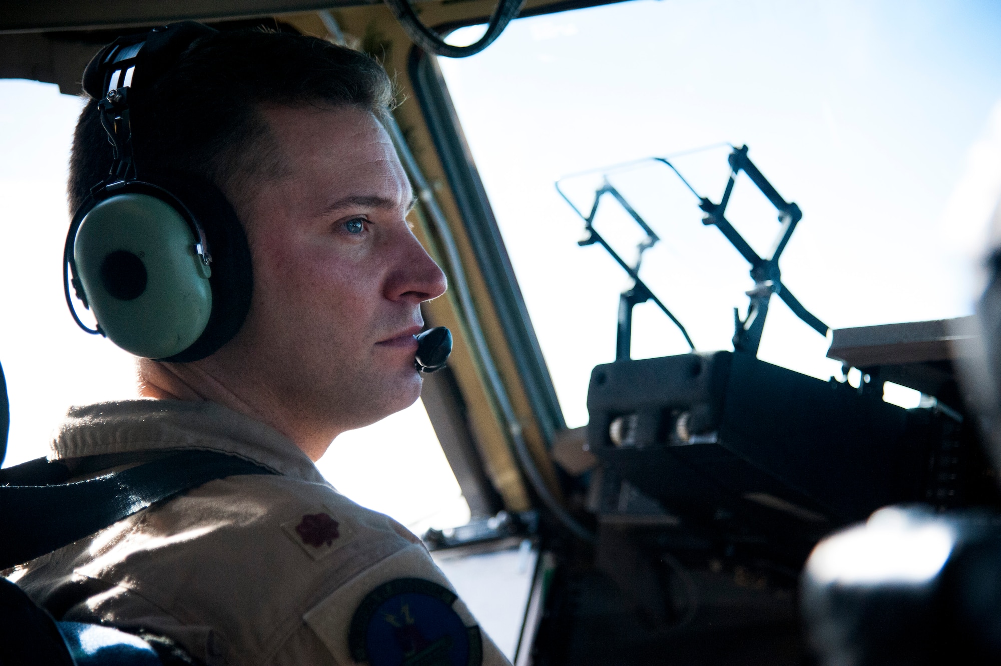 U.S. Air Force Maj. Brant Dixon, 817th Global Mobility Readiness Squadron Operations Officer and C-17 Globemaster III Instructor Pilot, commands a special two-part flying mission with the 6th Airlift Squadron, Joint Base McGuire-Dix-Lakehurst, N.J. Nov. 17-28. The mission was in support of Operation UNITED ASSISTANCE and an U.S. Air Force Special Operations team downrange. (U.S. Air Force photo/Staff Sgt. Destinie Berry/RELEASED)